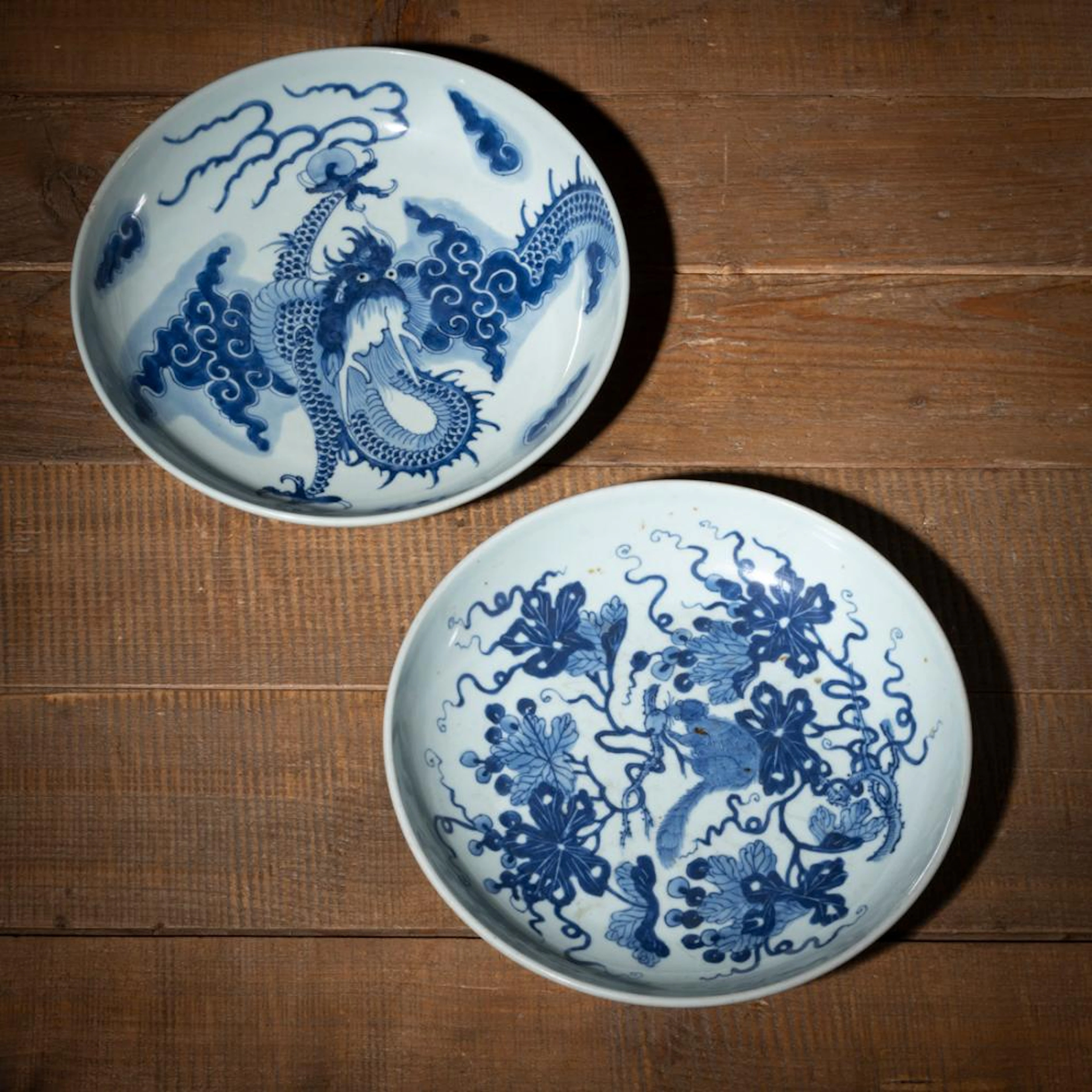 TWO BLUE AND WHITE PORCELAIN DISHES WITH DRAGON AND A SQUIRREL WITH GRAPE VINES
