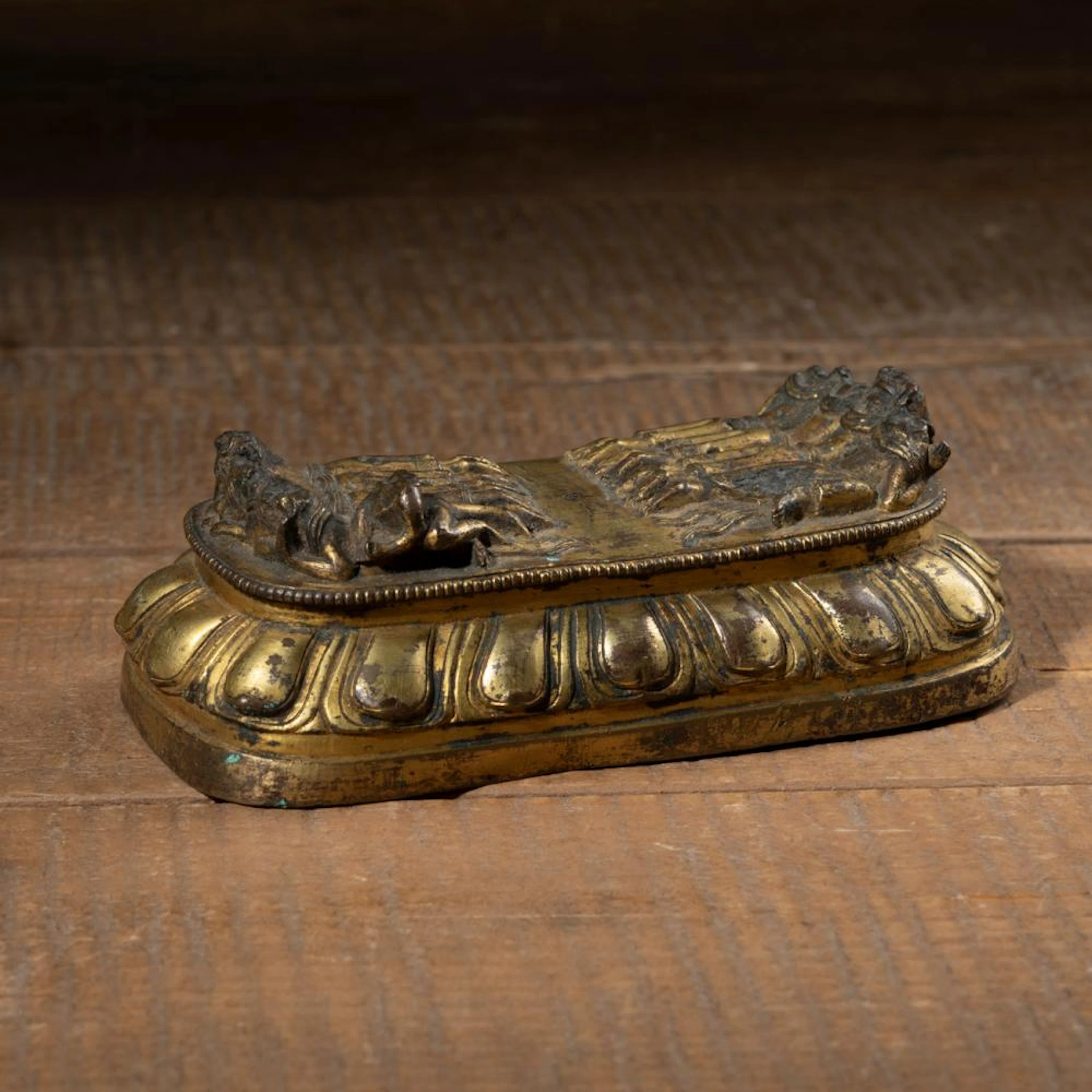 A GILT-BRONZE LOTUS BASE OF A YAMANTAKA
