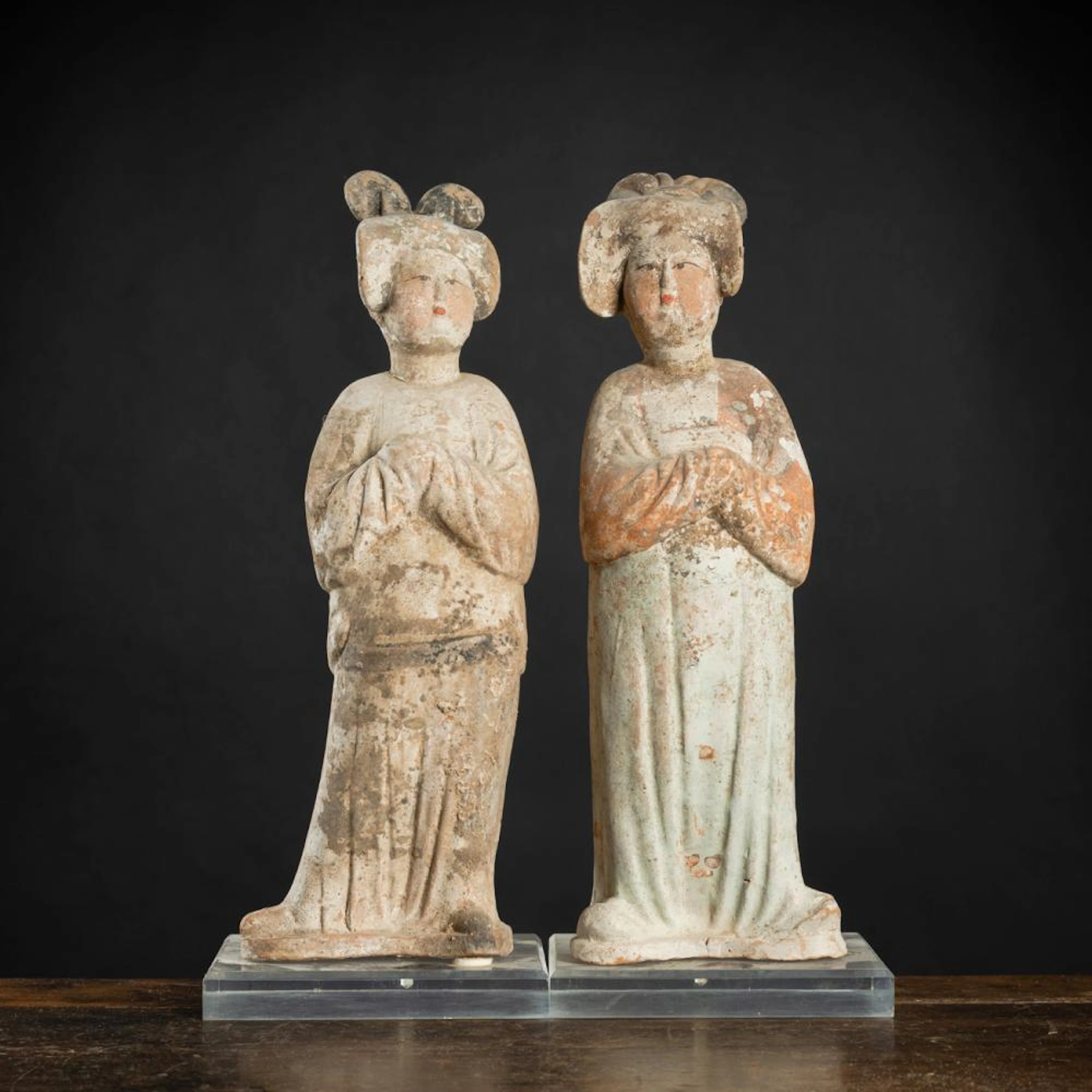 TWO POTTERY FIGURES OF 'FAT LADIES' WITH RESIDUE OF POLYCHROME PAINTING