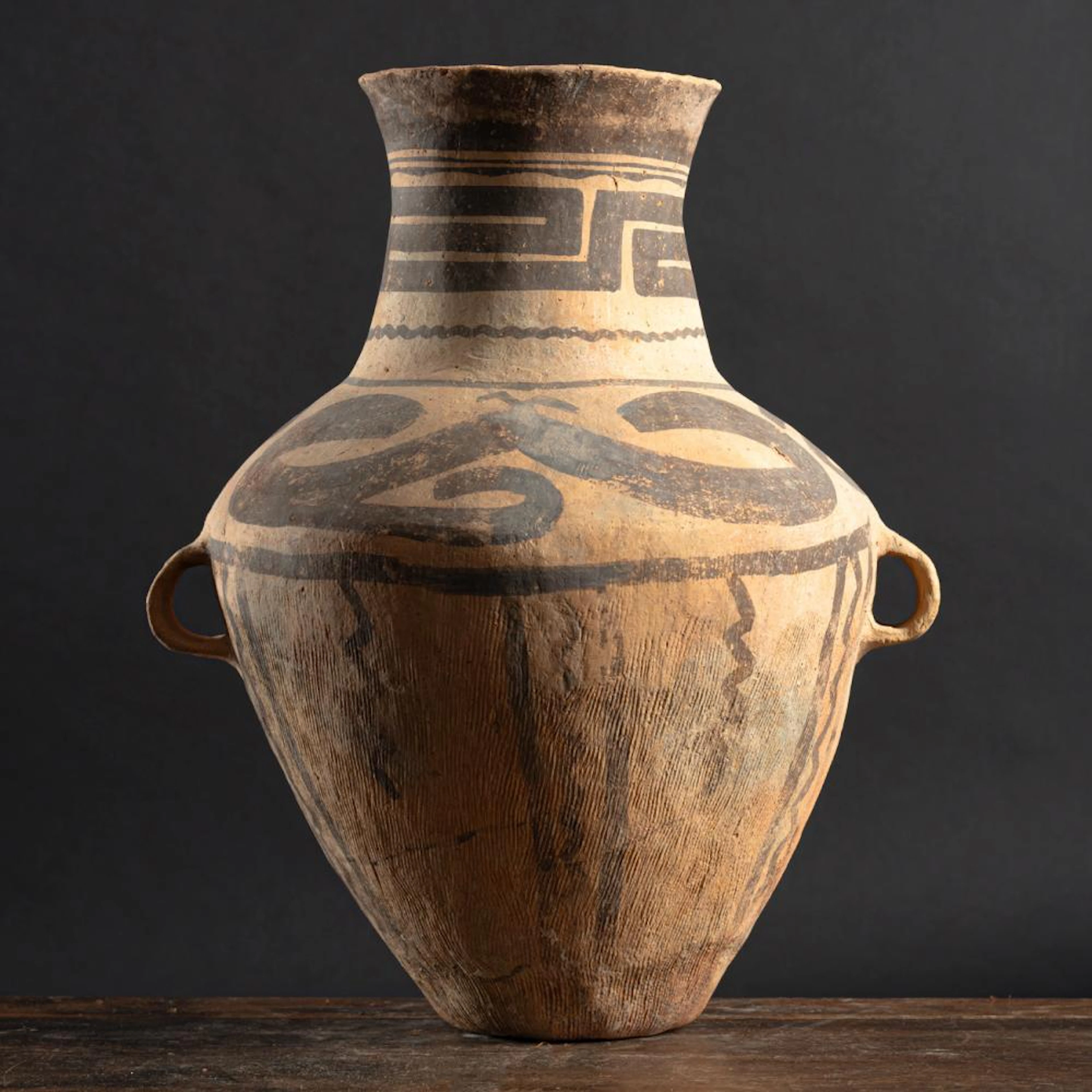 A MONOCHROME PAINTED POTTERY STORAGE VESSEL