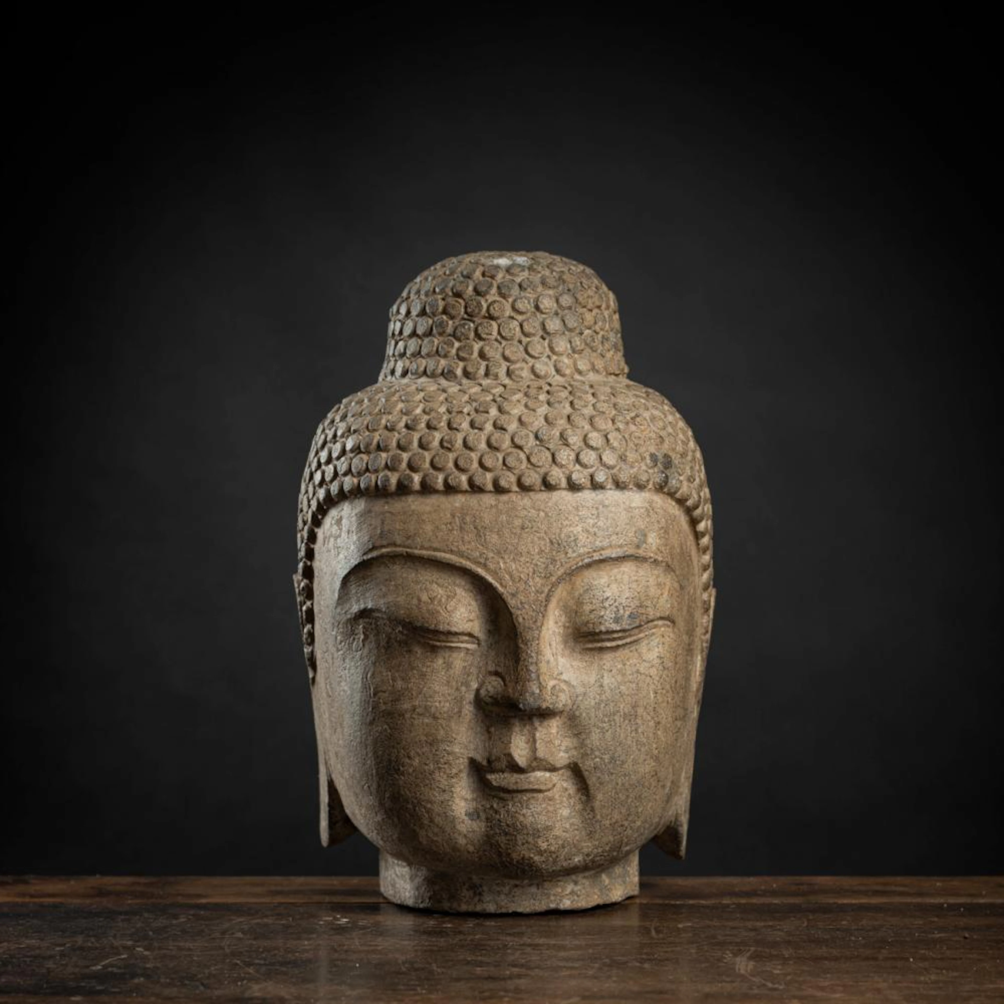 A SANDSTONE HEAD OF THE BUDDHA