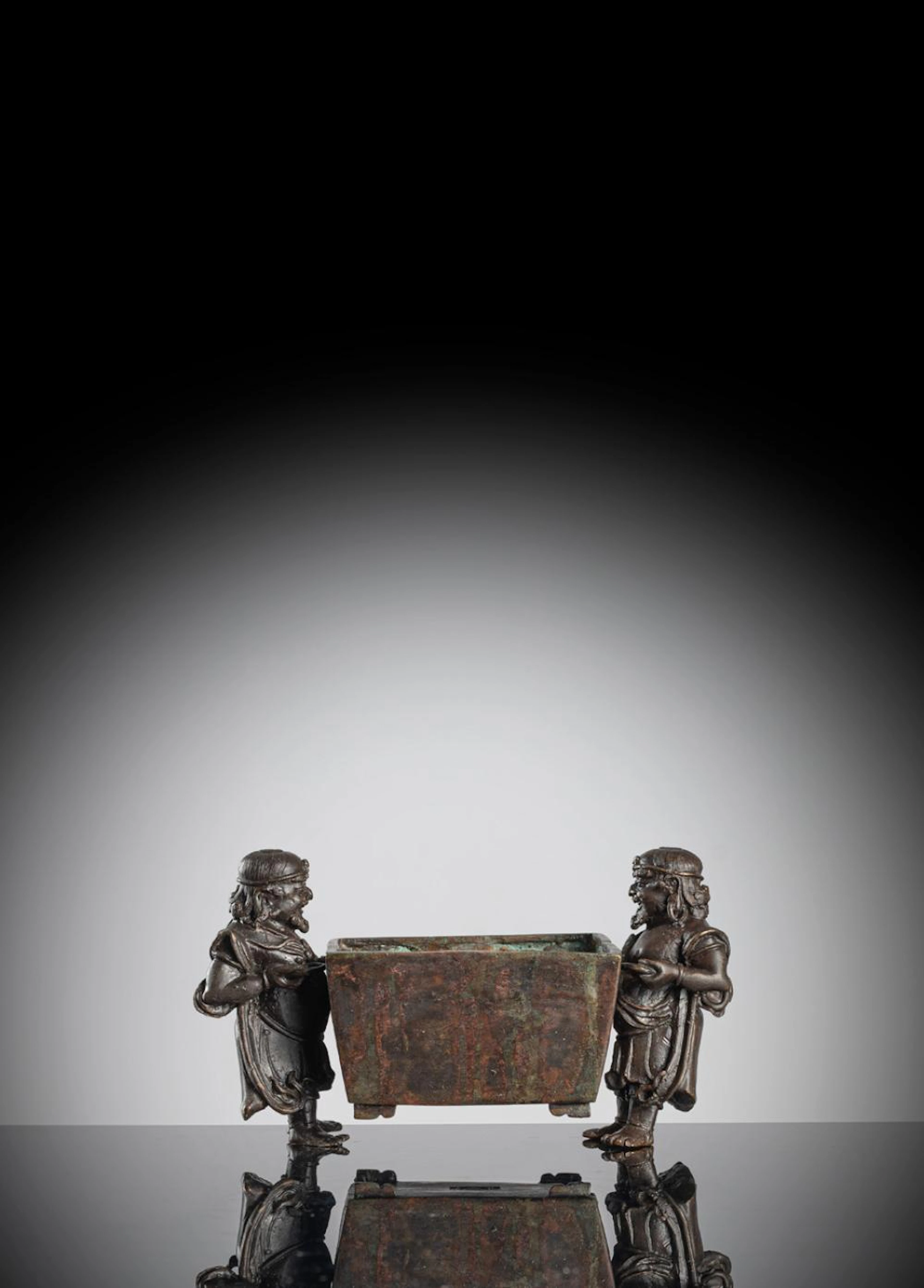 A BRONZE CENSER WITH FOREIGNOR HANDLES