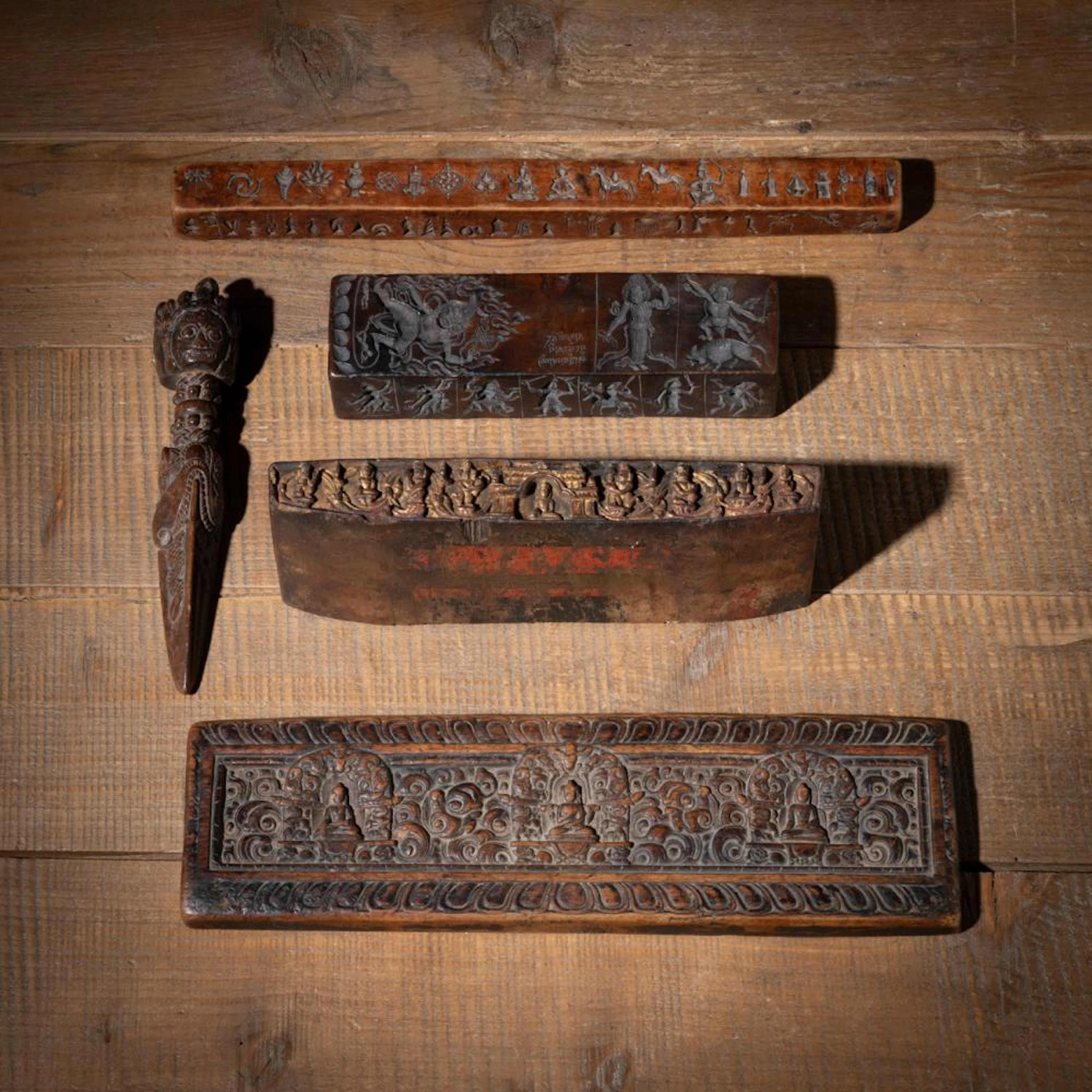 TWO MANUSCRIPT COVERS, A PHURBU, AND TWO ZANPAR MOLDS