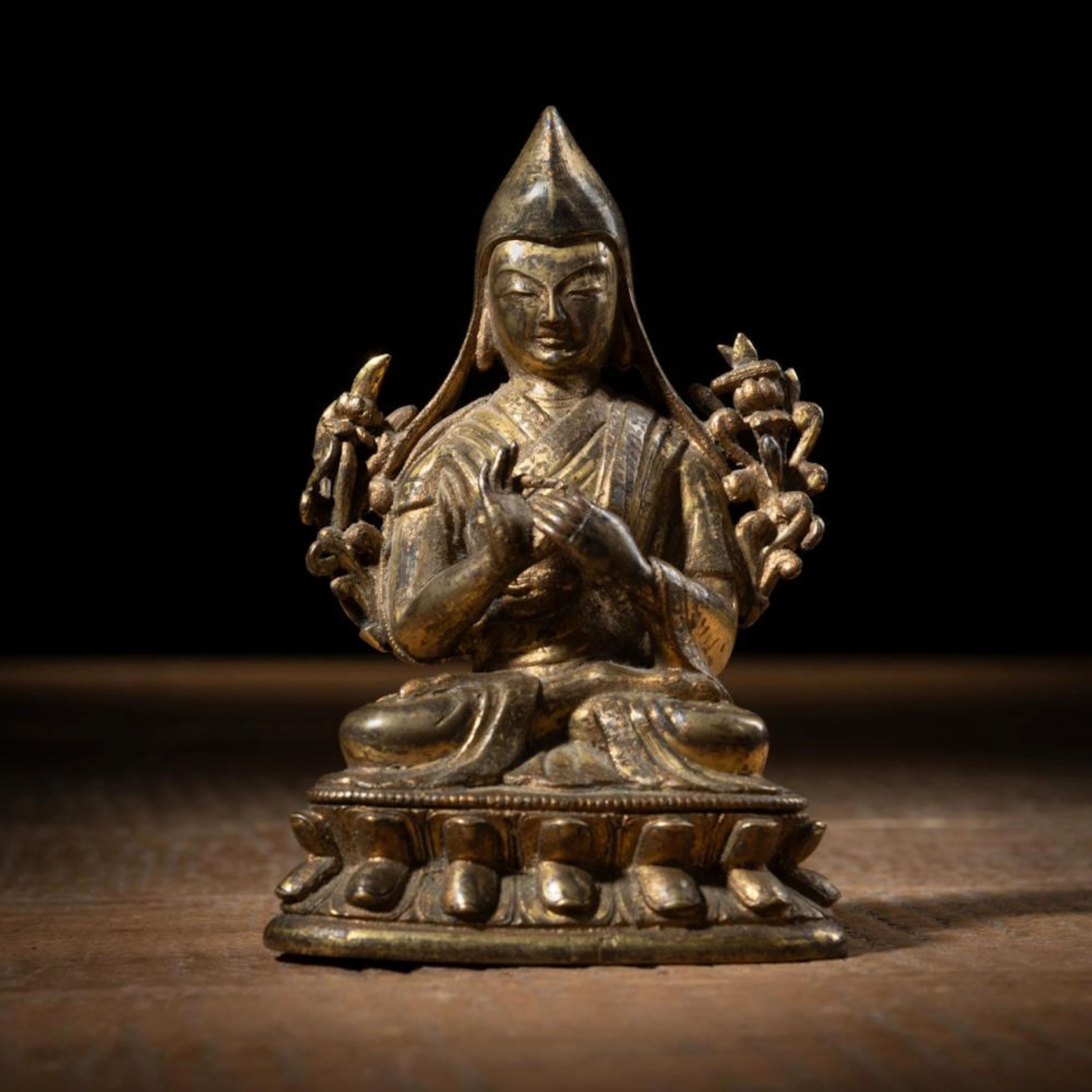 A GILT-BRONZE FIGURE OF TSONGKHAPA