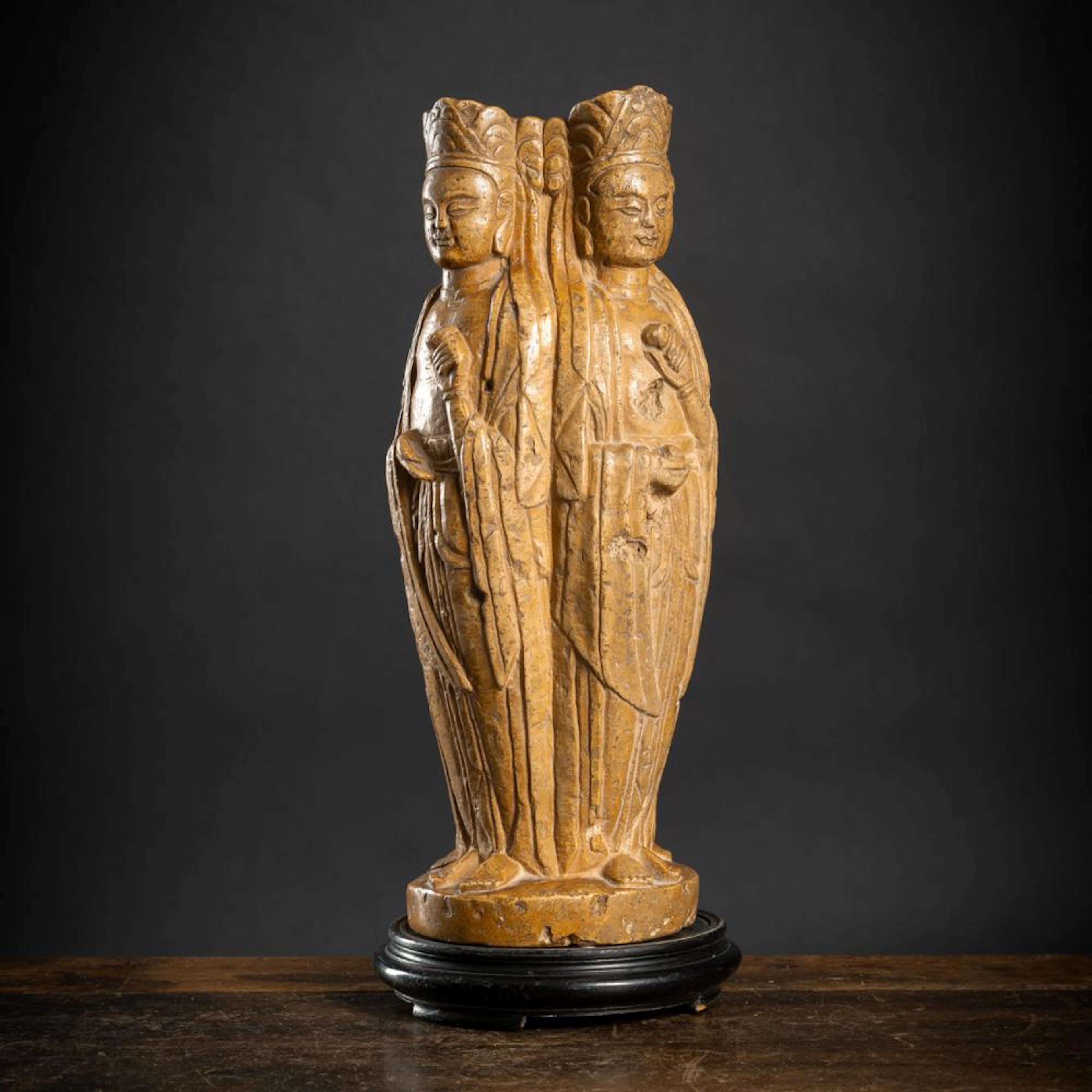 A FOUR BUDDHA STONE SCULPTURE