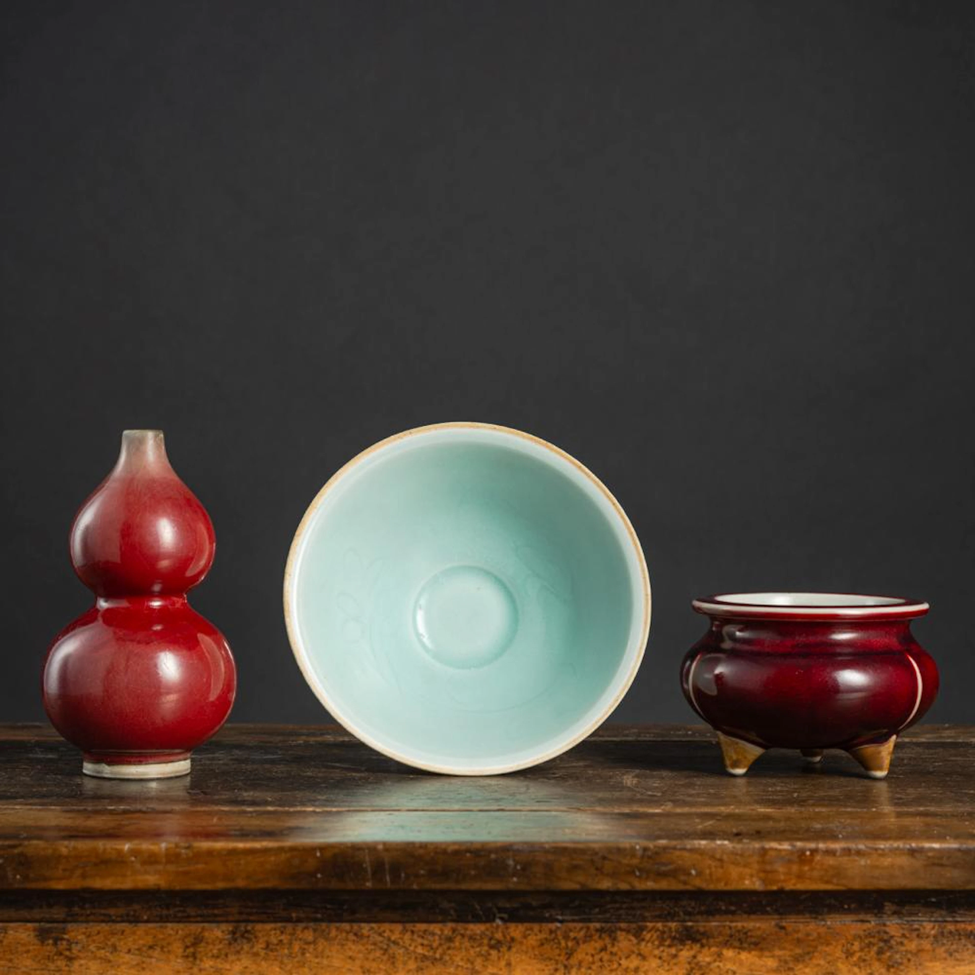 A COPPER-RED DOUBLE-GOURD VASE, A TRIPOD CENSER, AND A 'QINGBAI' BOWL