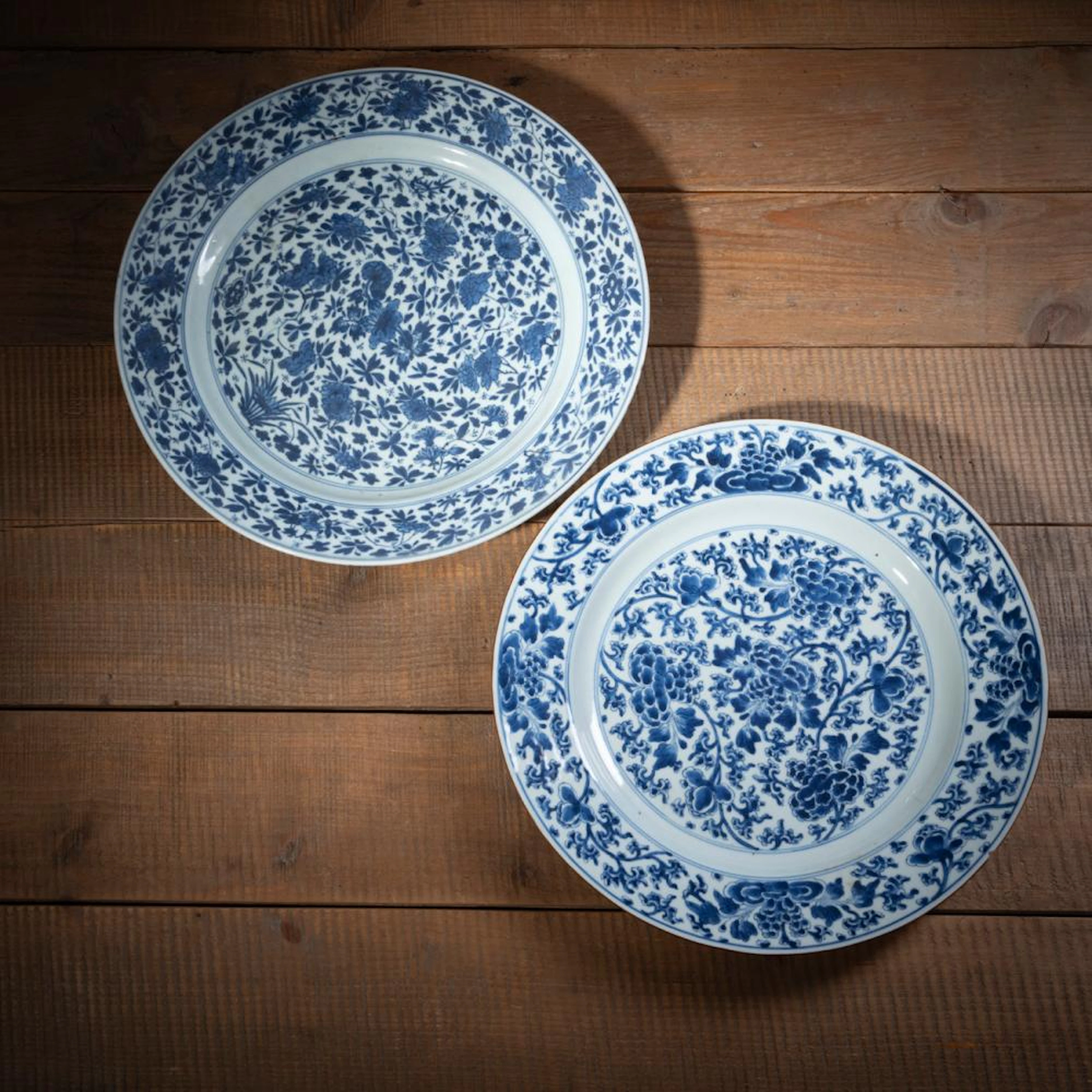 TWO BLUE AND WHITE FLORAL PORCELAIN CHARGERS