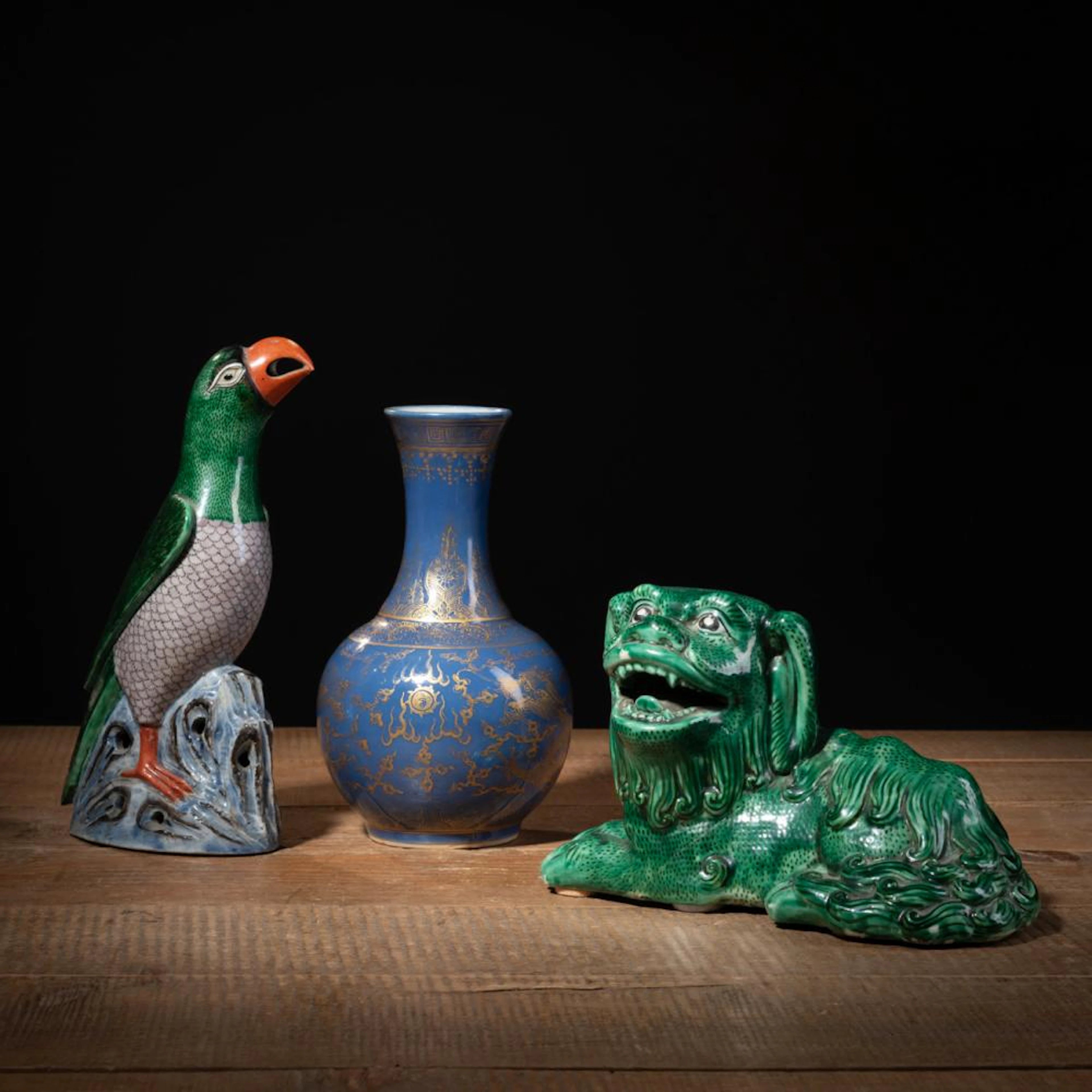 A SMALL POWDER BLUE GLAZED DRAGON BOTTLE VASE AND TWO...