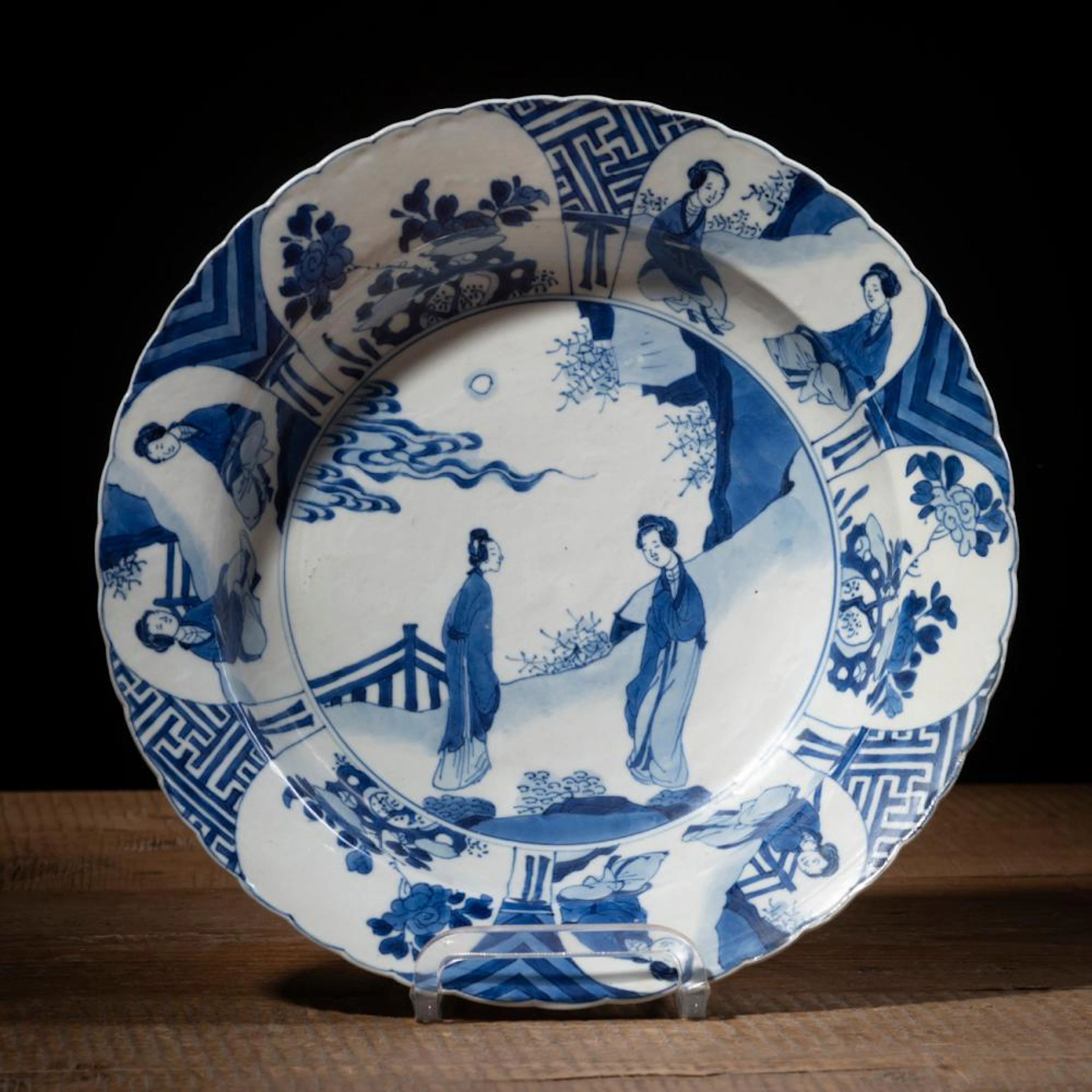 A FLORIFORM BLUE AND WHITE FIGURAL PORCELAIN DISH