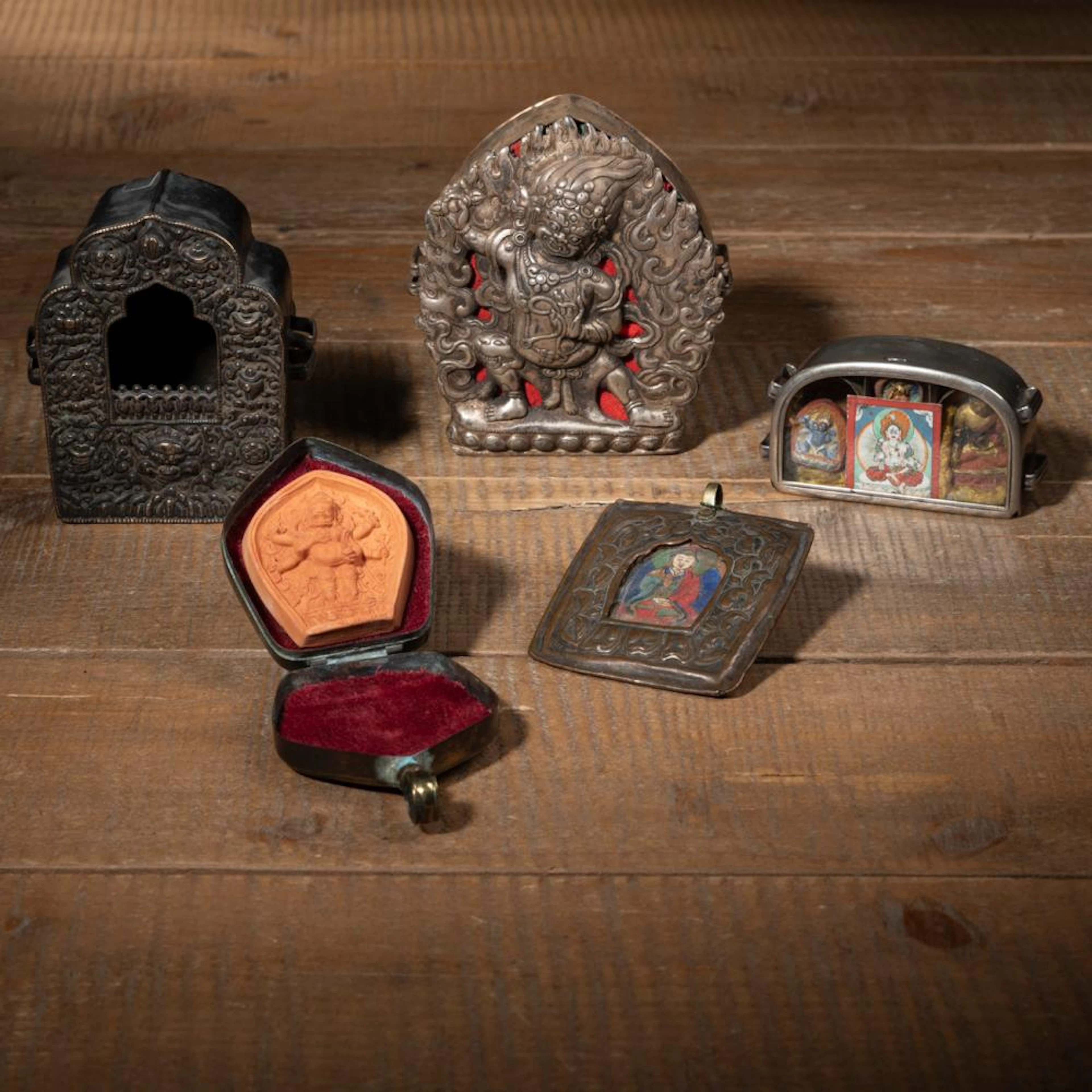 FIVE WHITE METAL AND COPPER TRAVEL SHRINES (GA'U)