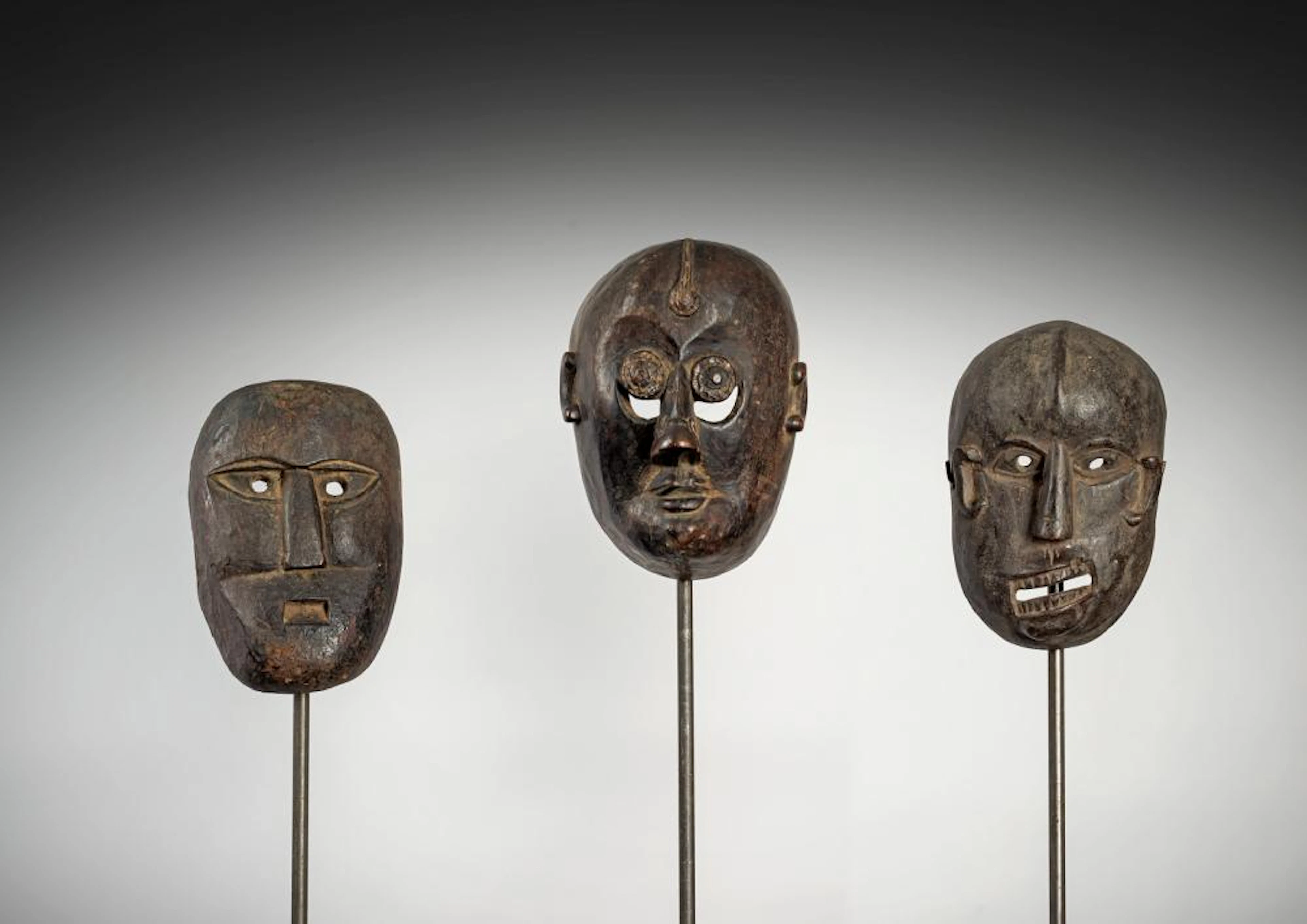 THREE RITUAL WOOD MASKS