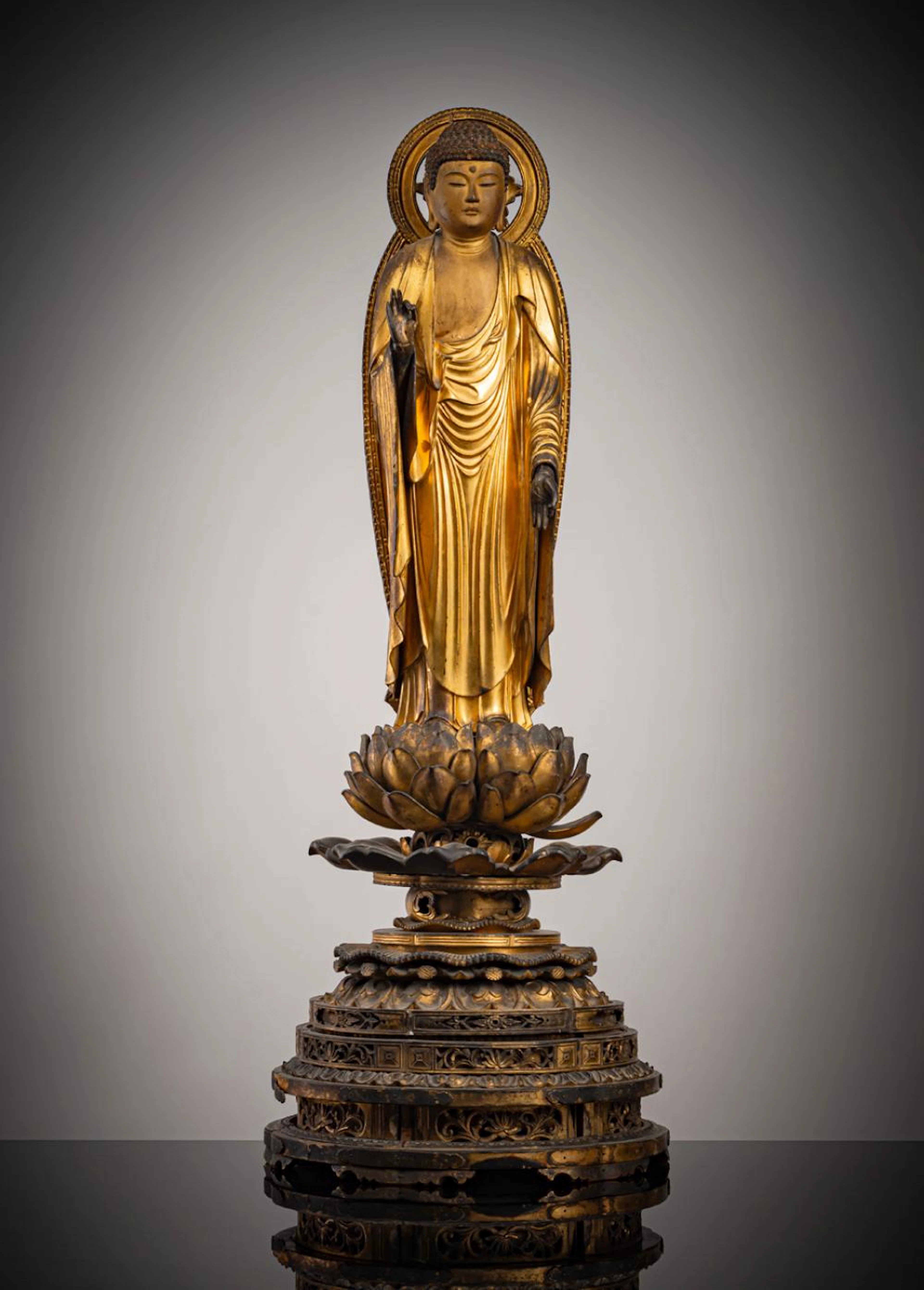 A GILT- AND BLACK- LACQUERED WOOD FIGURE OF BUDDHA AMIDA