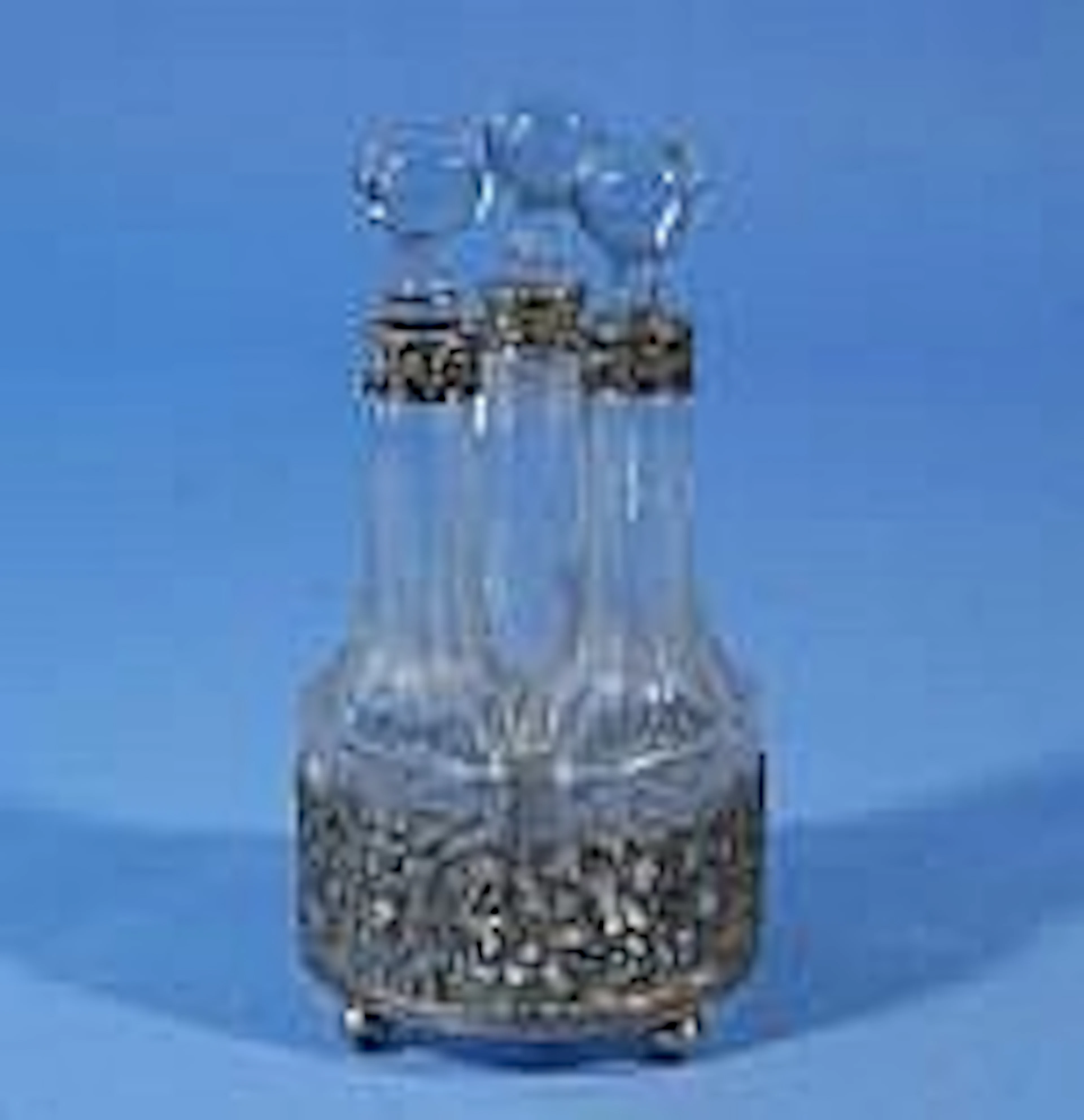 Crystal oil and vinegar set in silver holder