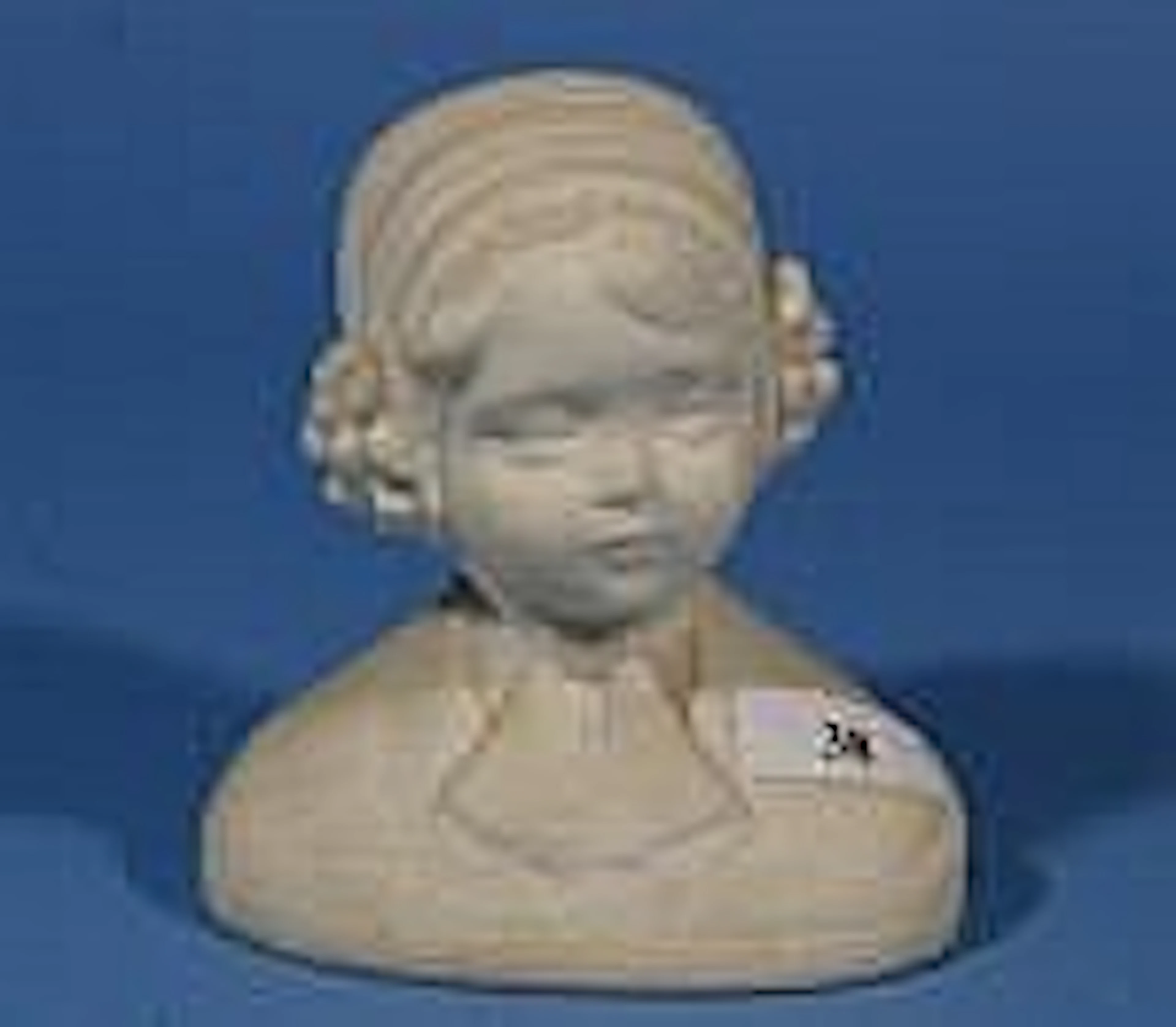 Alabaster child's head, h. 14 cm.