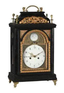 AN AUSTRIAN EBONISED SMALL TABLE CLOCK WITH CONCENTRIC CALENDAR AND ...