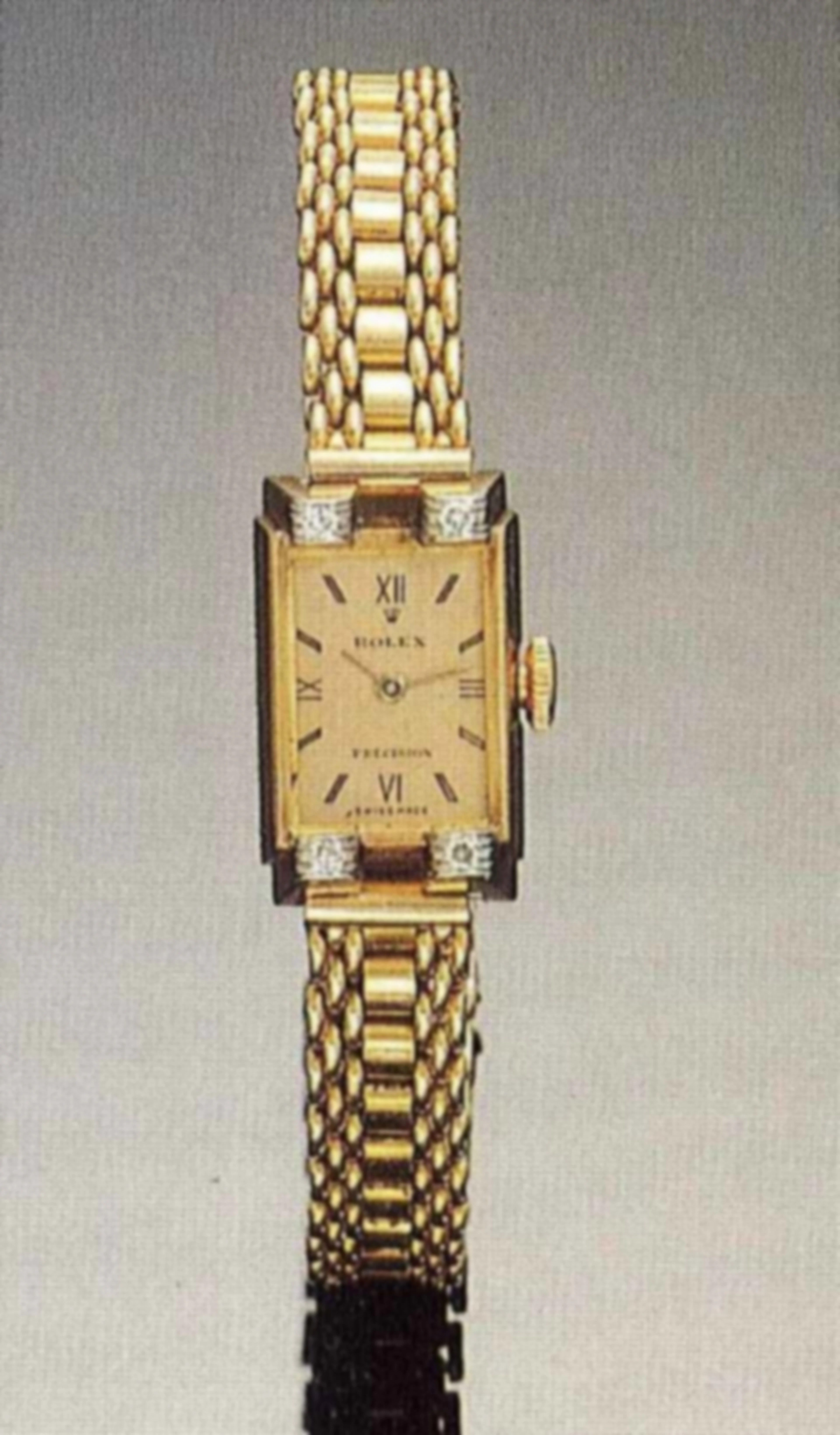 Rolex Precision, Ref. 3979, anni '40. Elegante orologio rettangolare da polso, per donna, in oro rosa 18 ct. e 4 brillantini, con bracciale in oro rosa 18 ct. applicato.