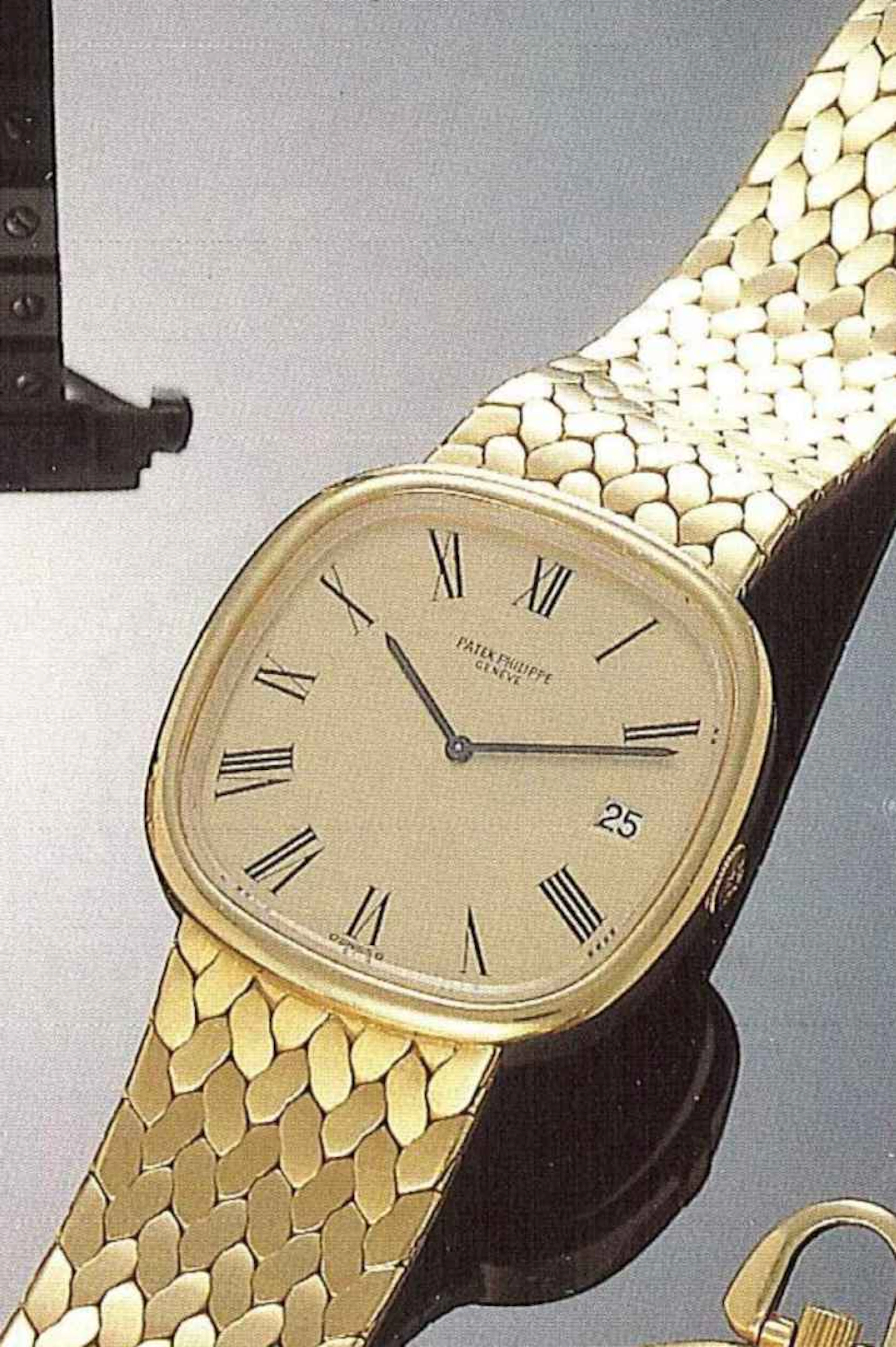 Patek Philippe, Genève, recente. Interessante orologio da polso, per uomo, in oro 18 ct., con bracciale integrato in oro a chicchi di riso, con scatola.