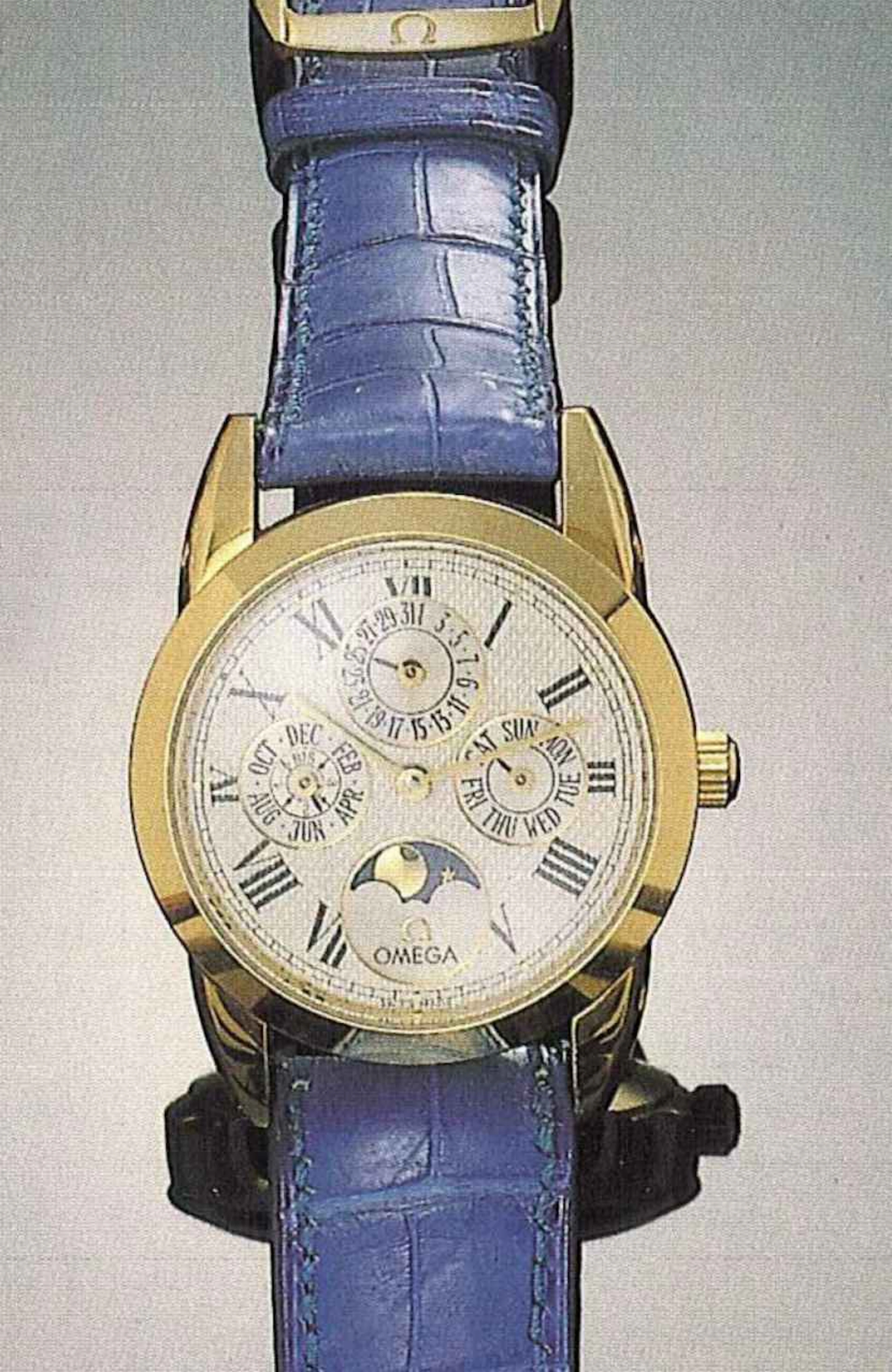 Omega, Louis Brandt, attuale produzione. Elegante orologio da polso, per uomo, in oro 18 ct., automatico, calendario perpetuo, fasi di luna.