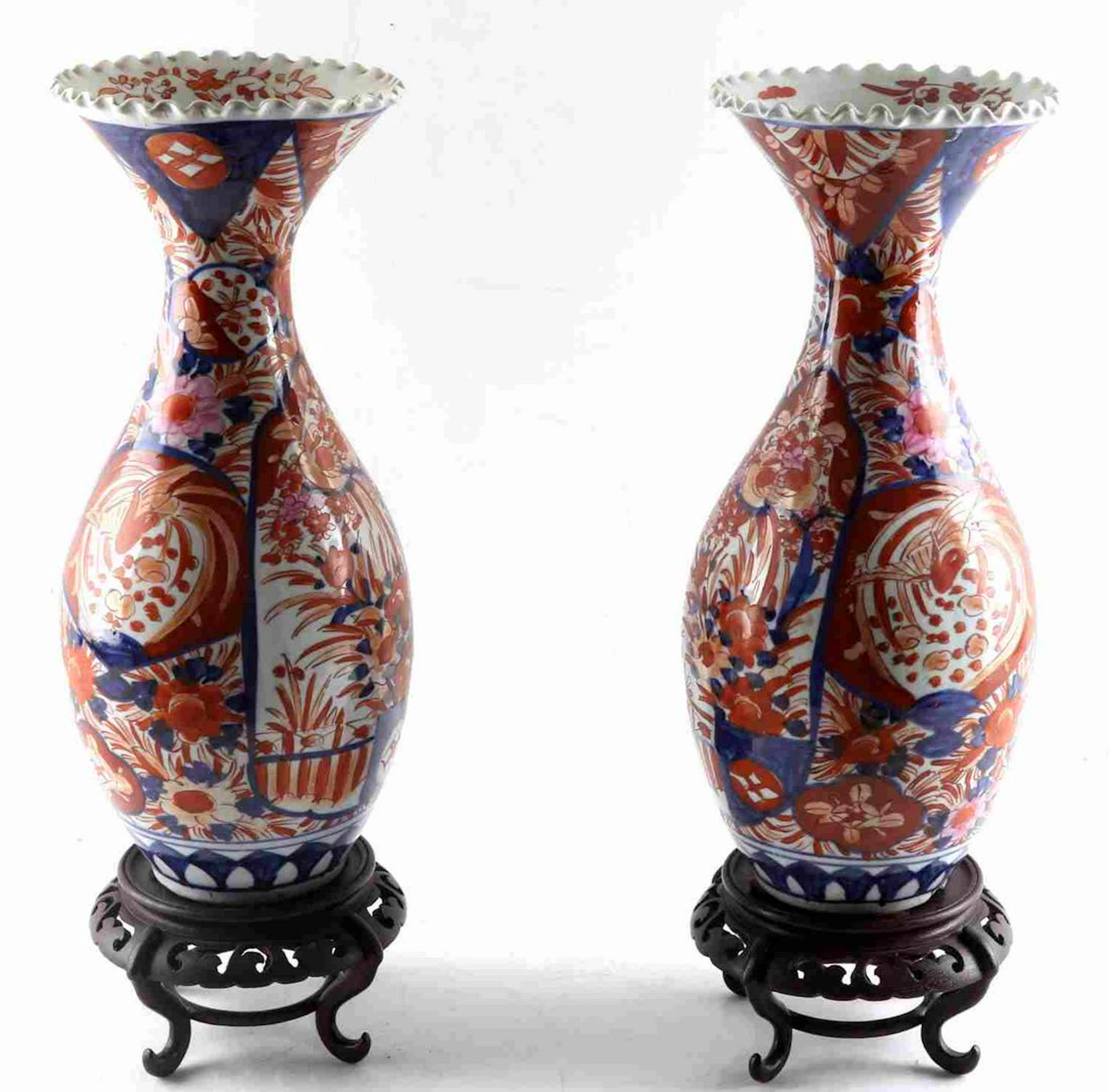 Pair of imari hand painted porcelain vases stand
