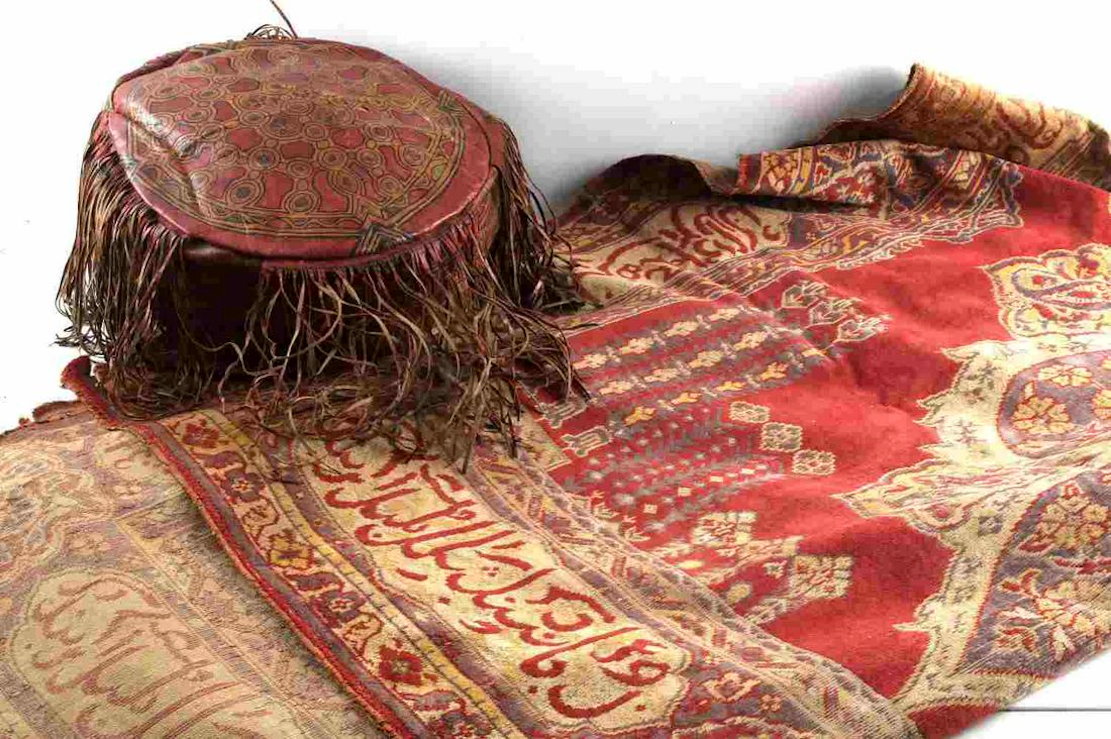 Moroccan fringed leather ottoman & wool rug
