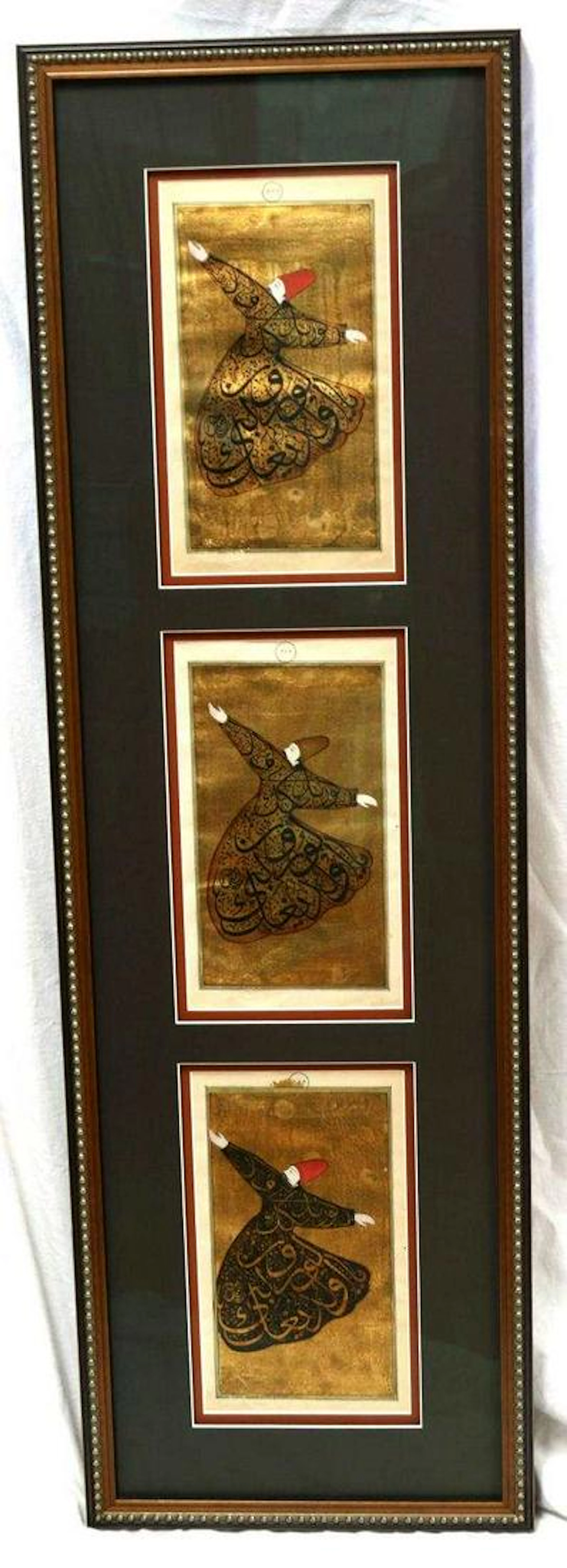 Framed whirling dervishes manuscript pages