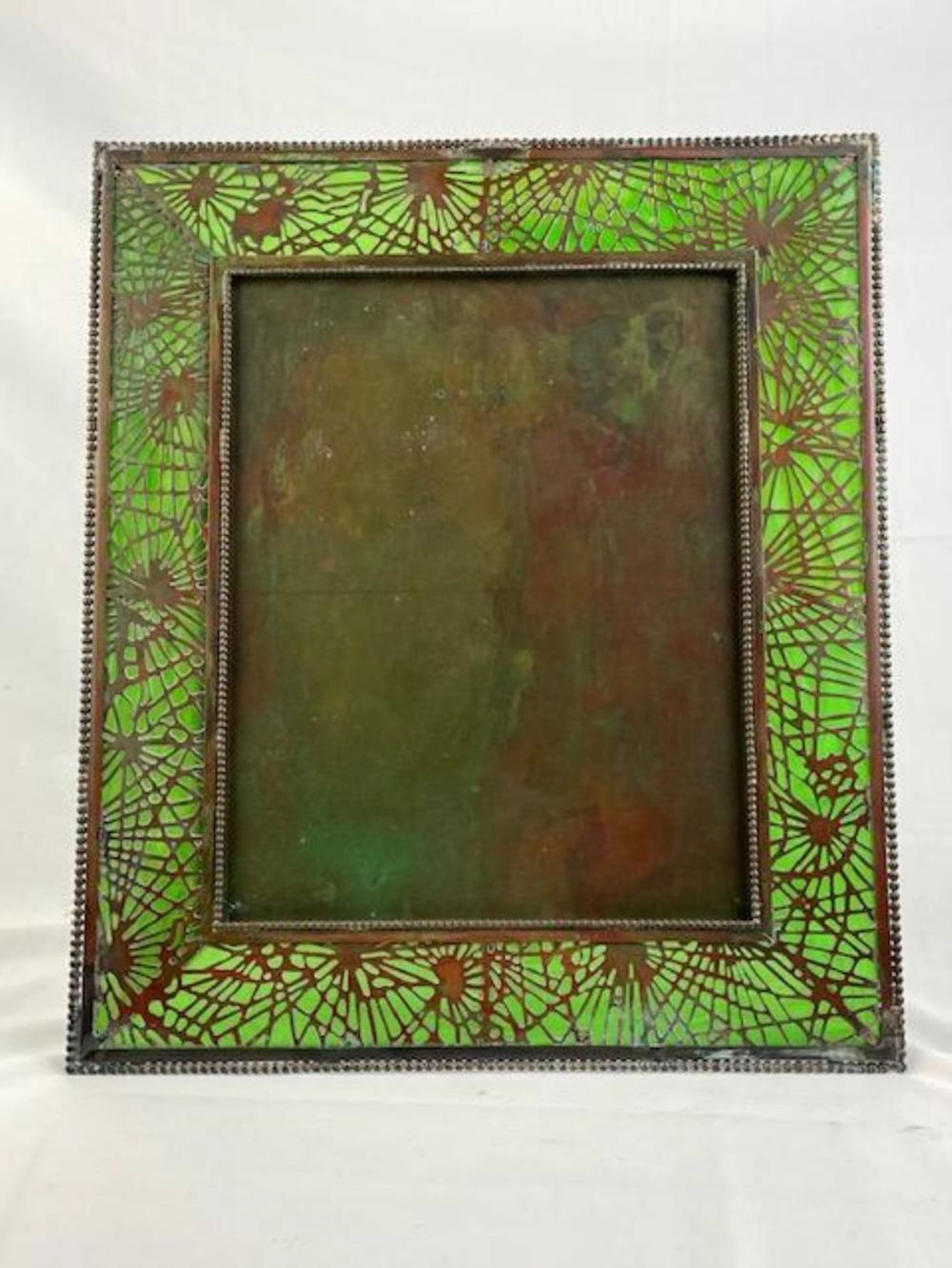 Tiffany Studios large photo frame in Pine needle with green slag glass