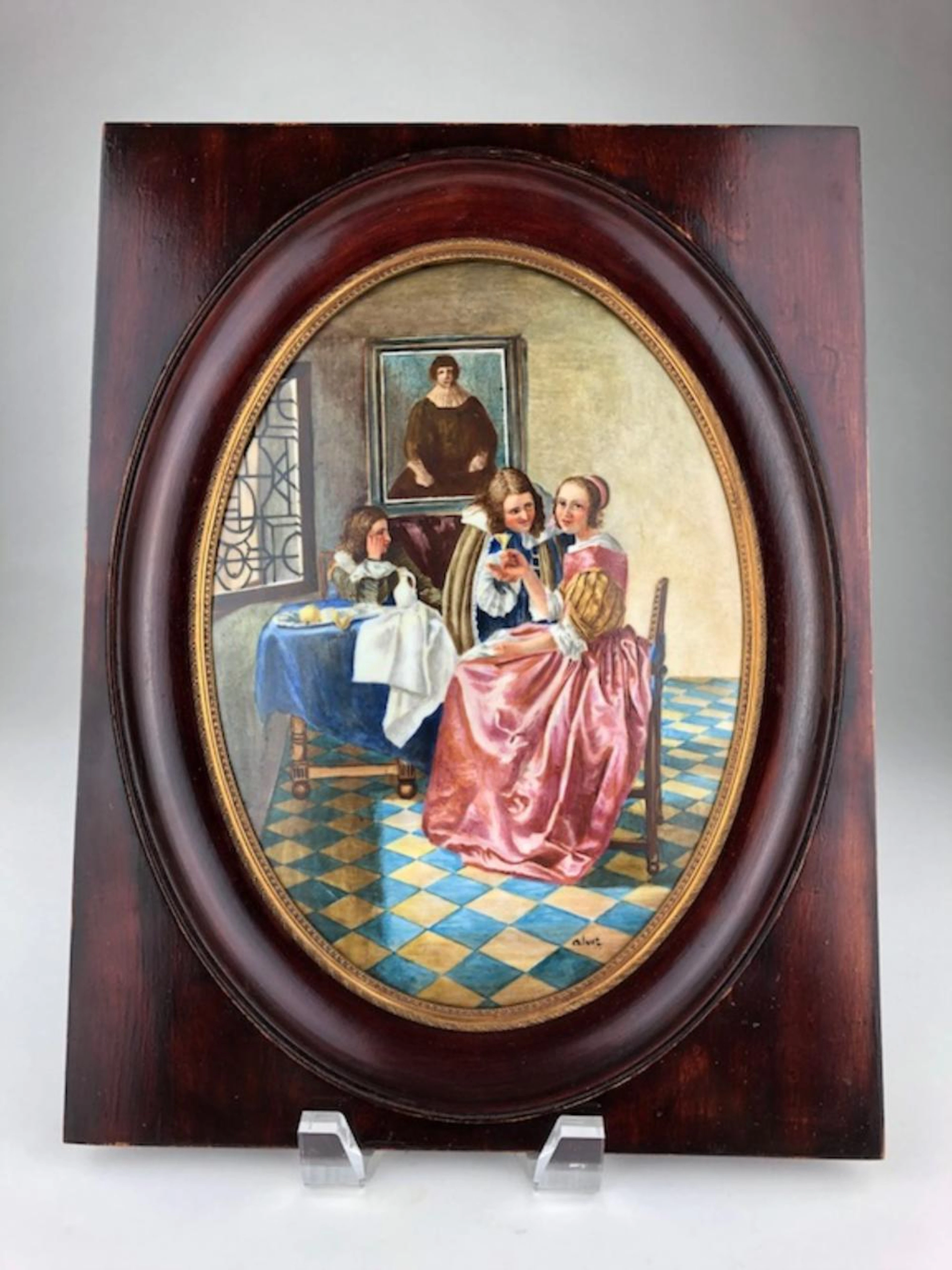 Oval painted plaque after Johannes Vermeer titled "Girl With a WIne Glass".