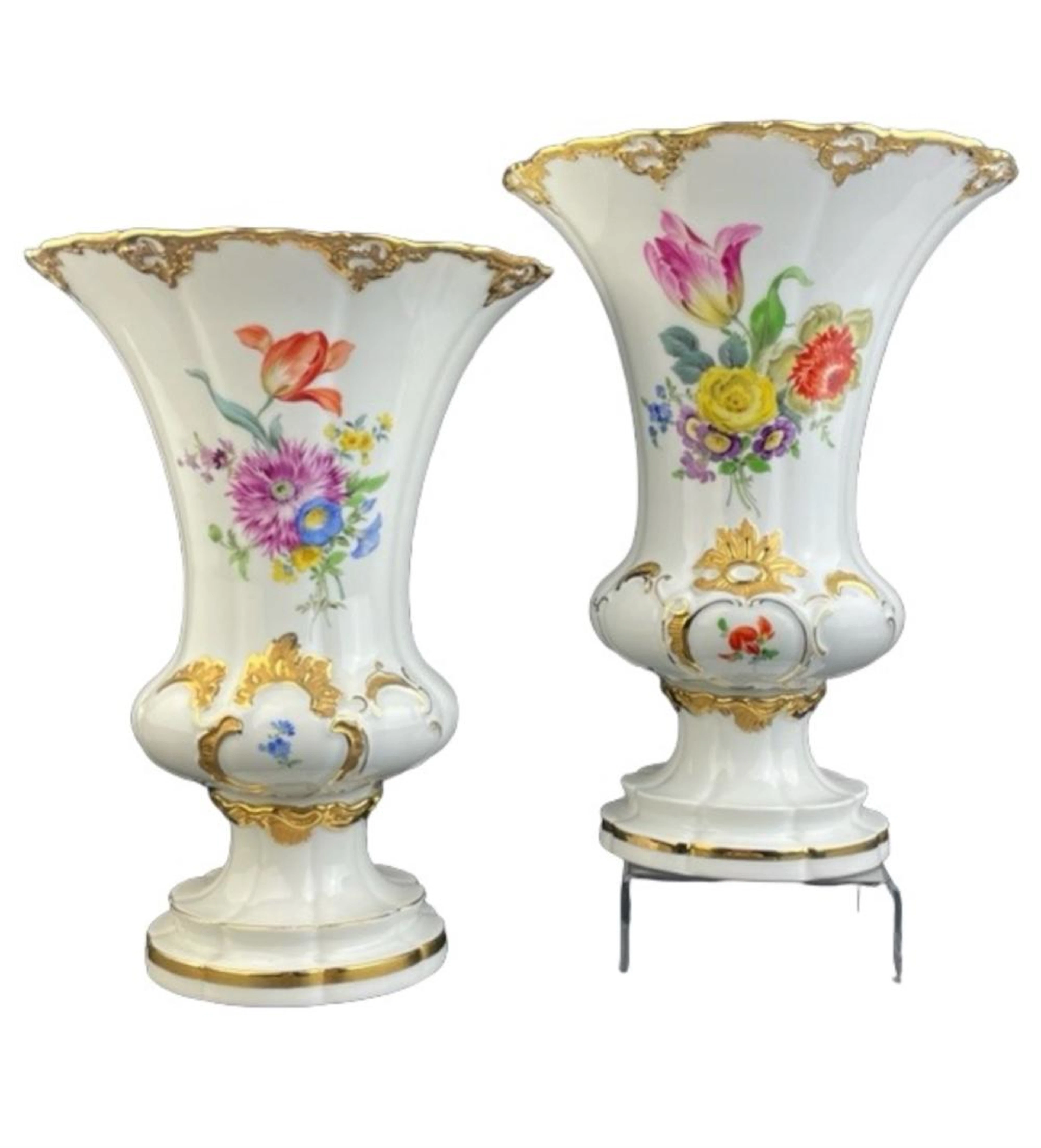 Meissen. A lovely pair of Meissen vases with painted gold gilt top rims.