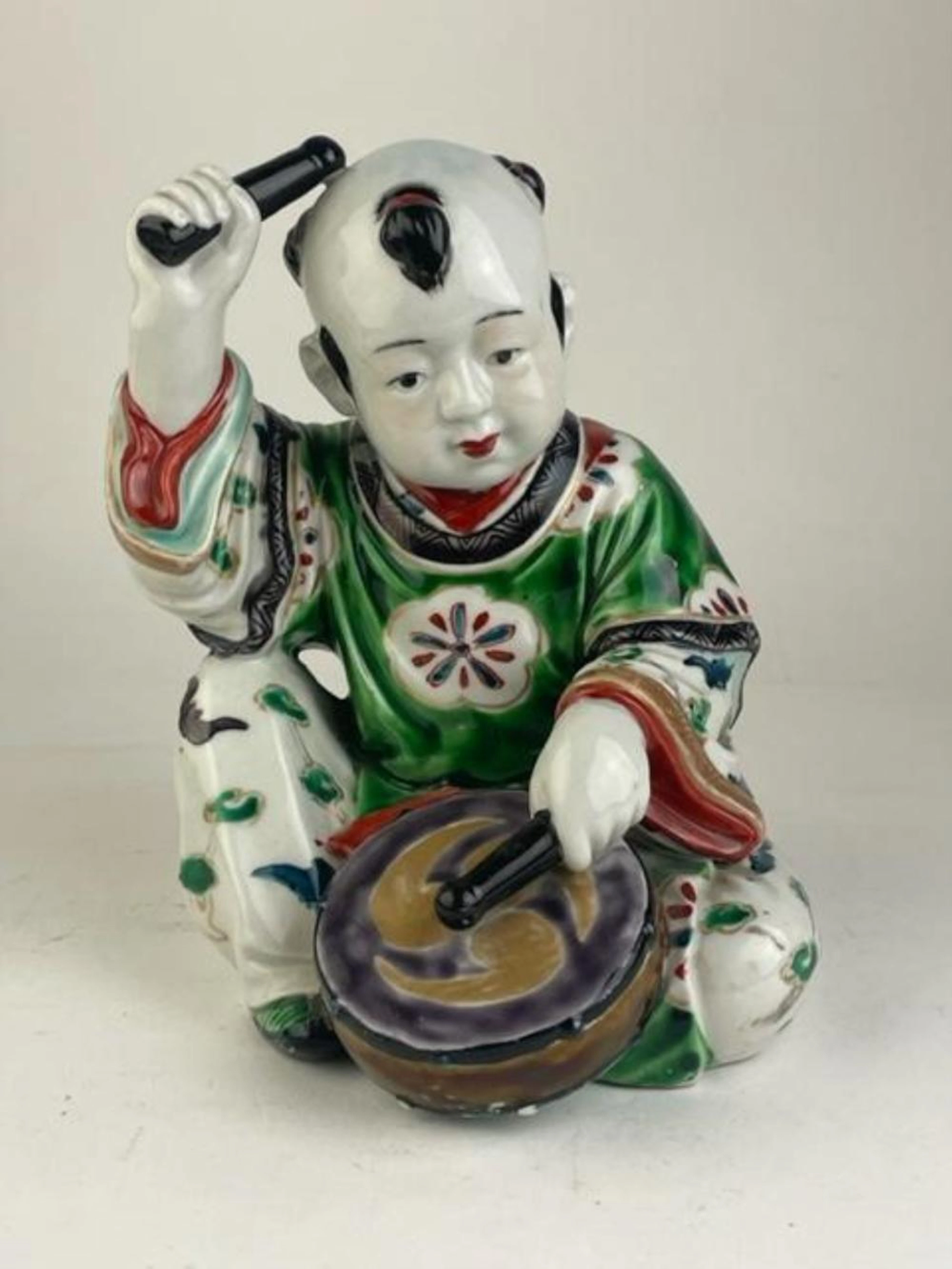 Japanese arita porcelain figure of a drummer boy.