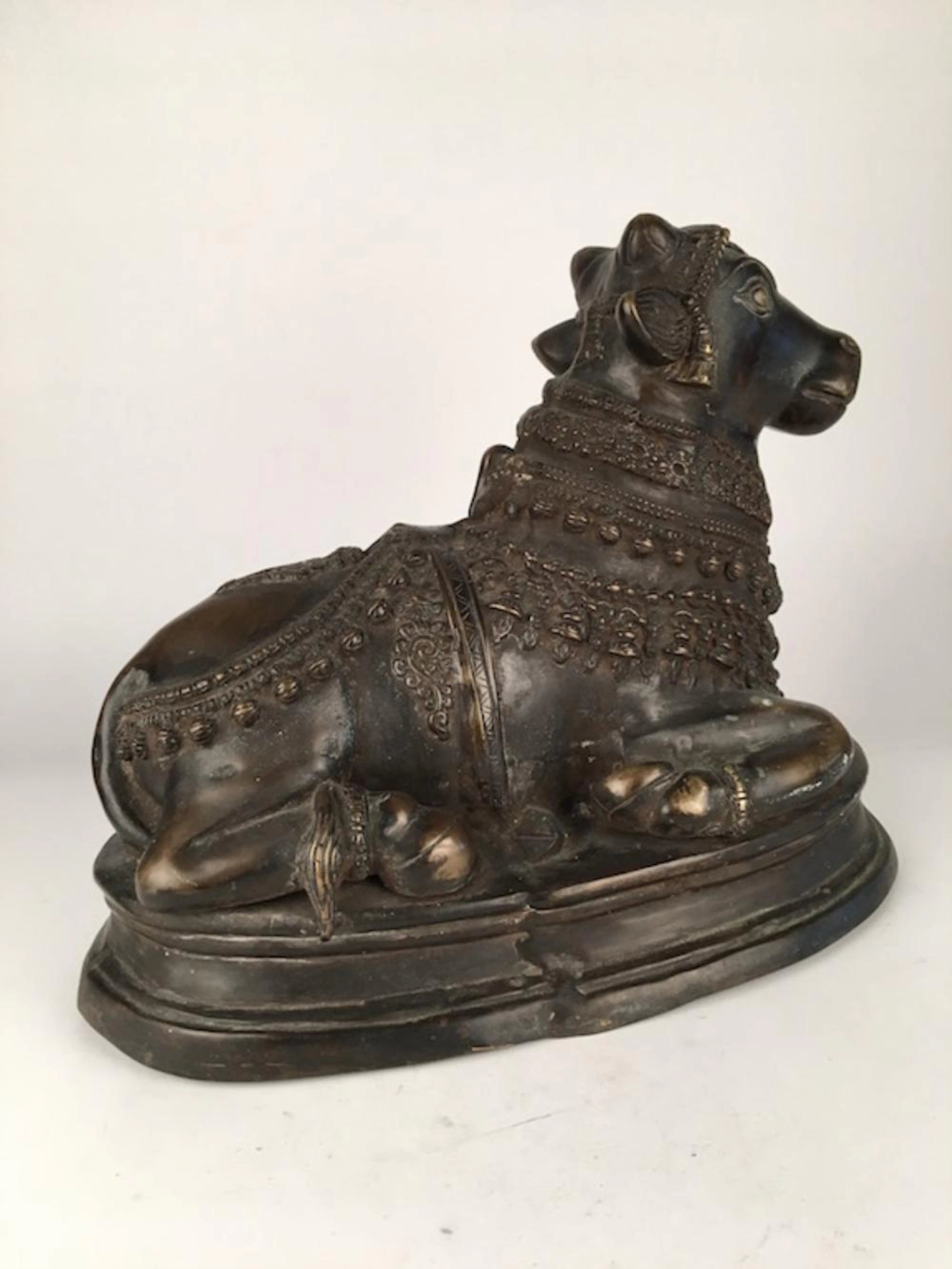 Bronze figure of a lamb in clothing. 18 inches x 13 inches.