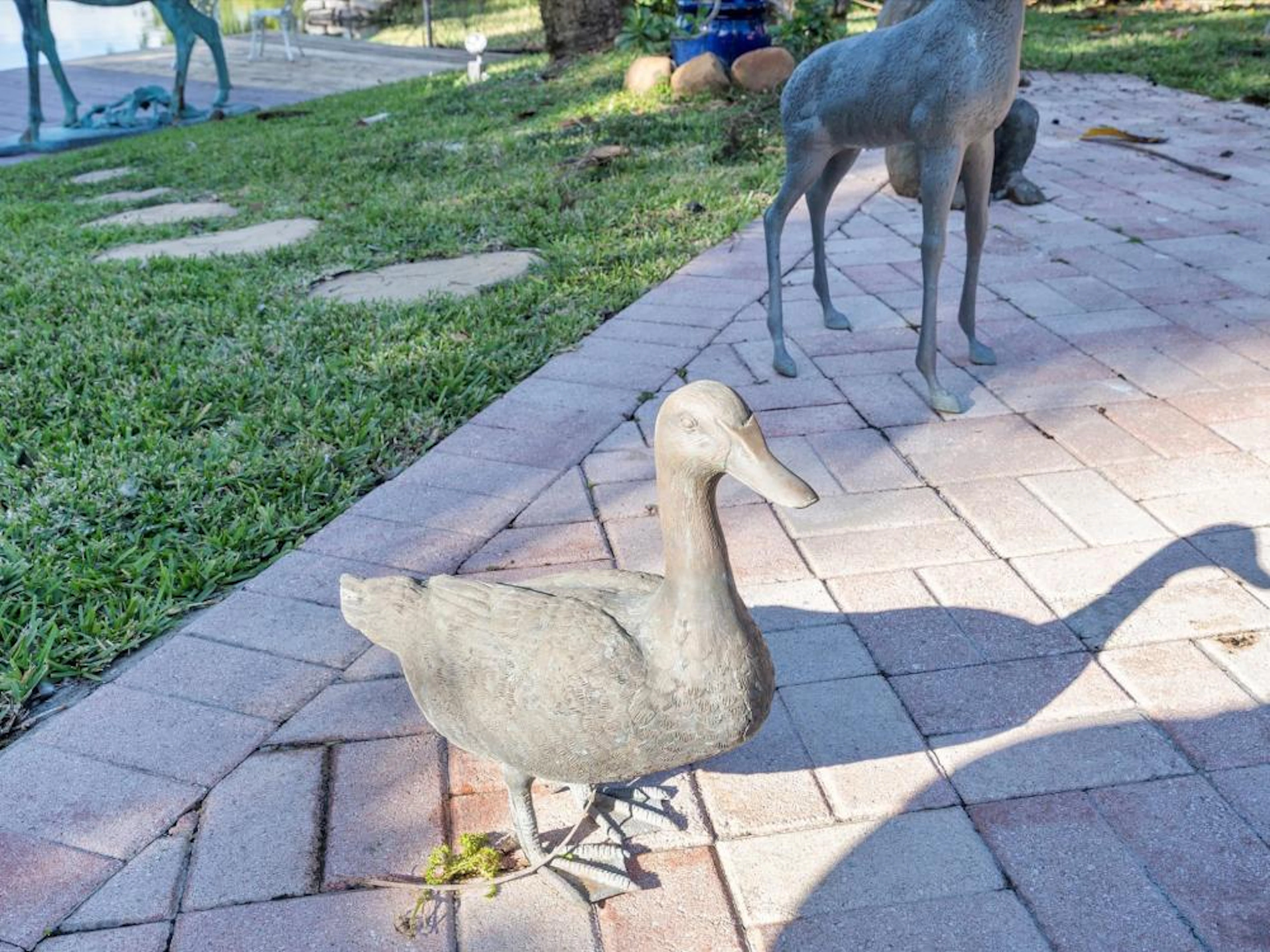 A bronze 16 inch tall duck.
