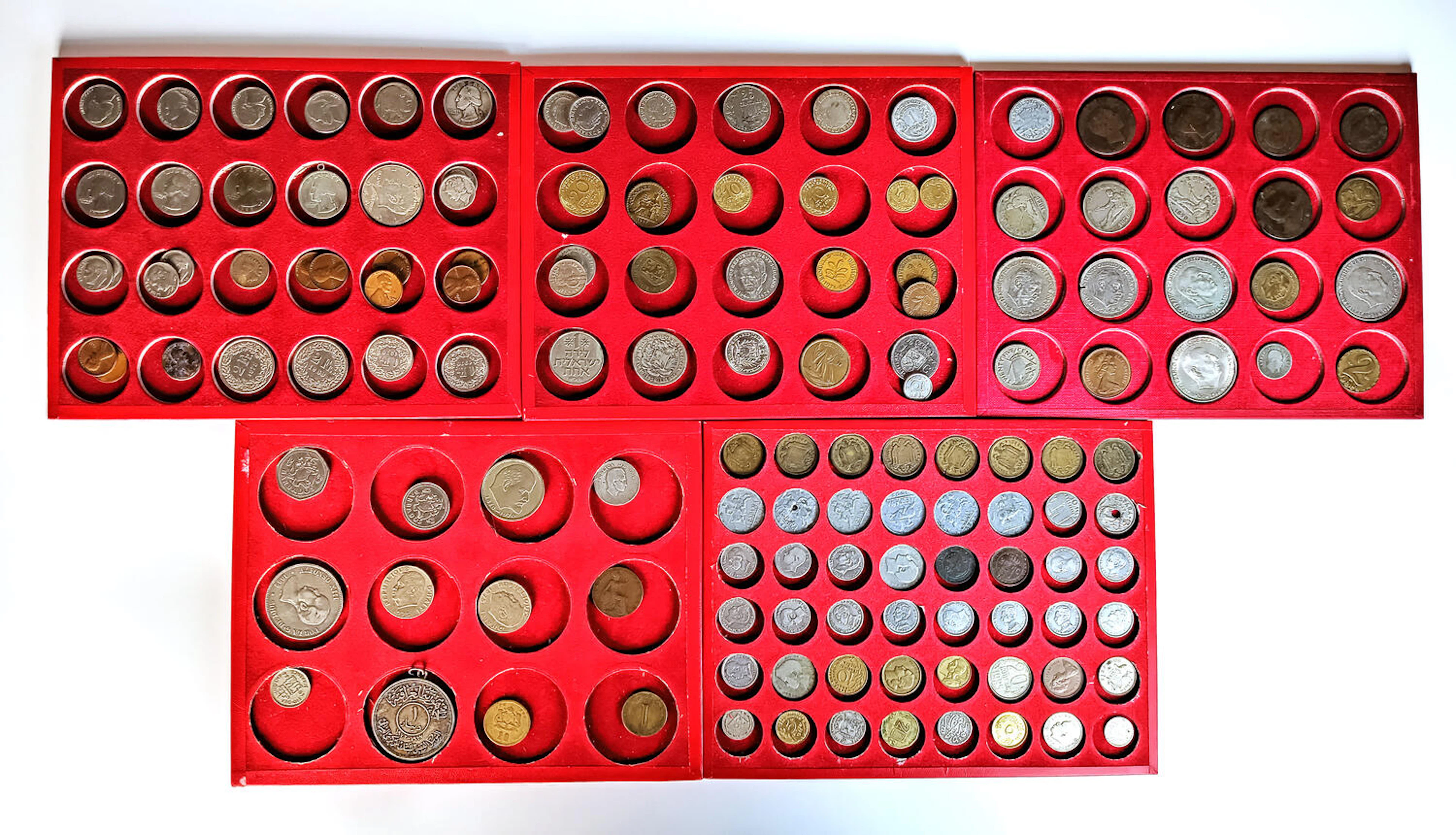 Boxed set of 136 world coins in a red case with clamps