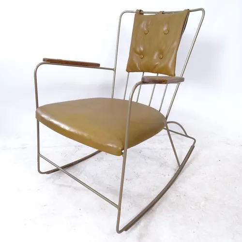 A mid-century Ernest Race rocking chair, with teak armrests ... | Barnebys