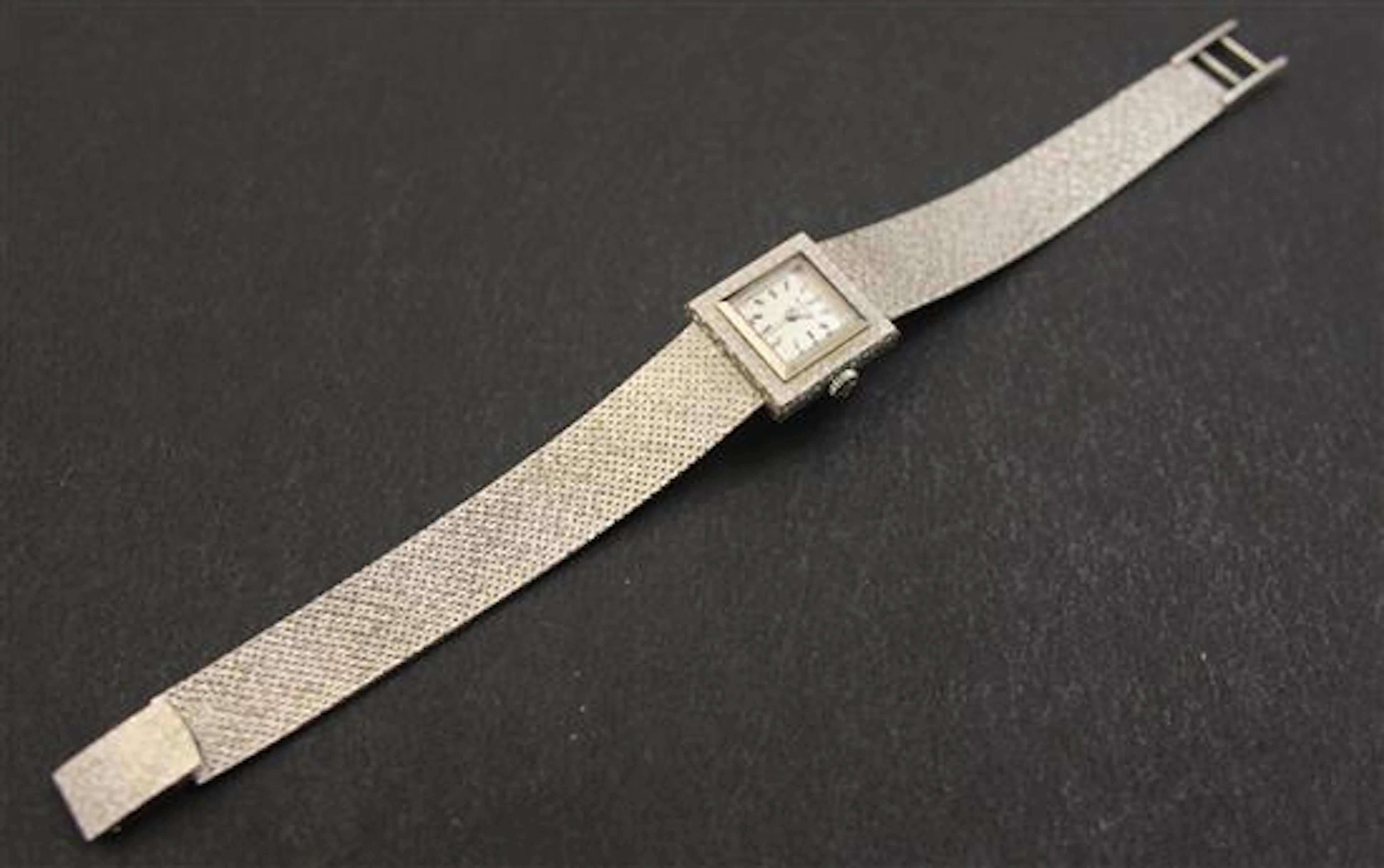 MILUS STAMPED 18K WHITE GOLD LADIES WATCH, 6 1/2" L 35.2 GRAMS TOTAL
