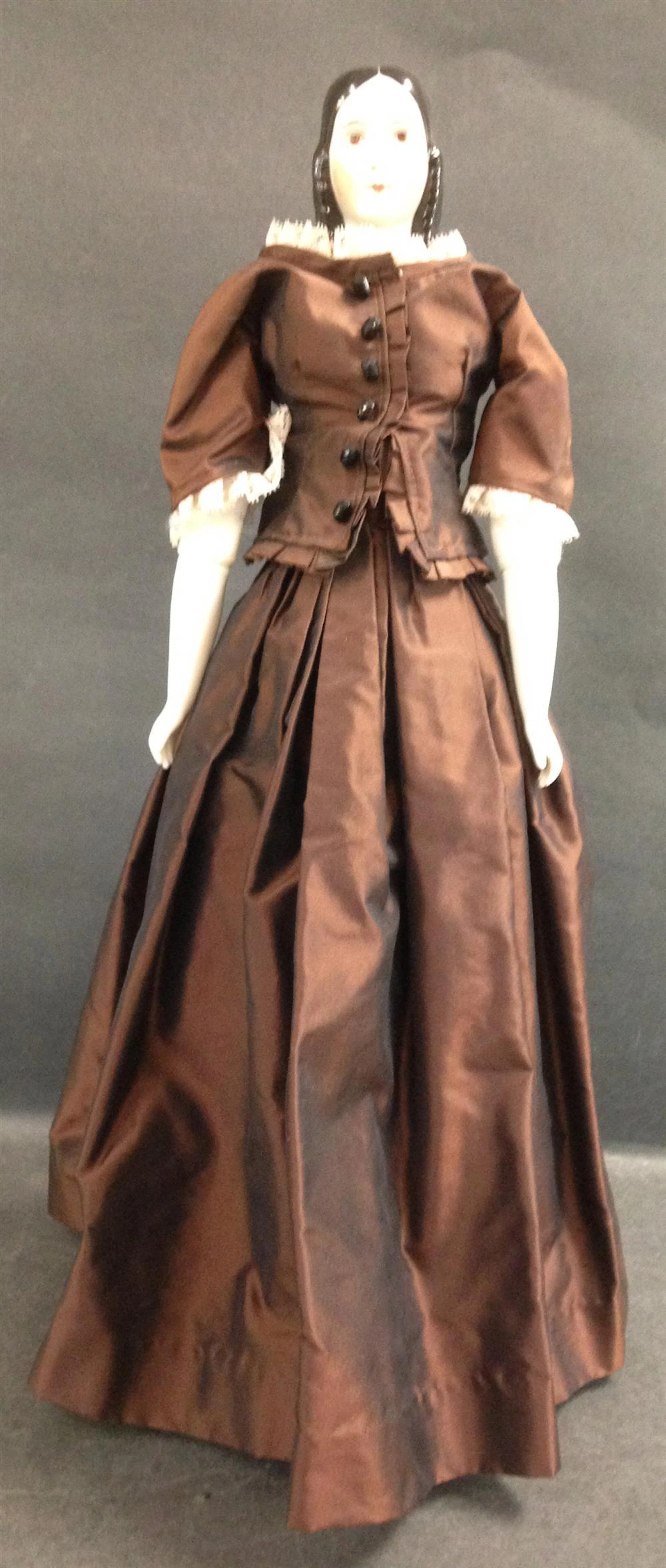 21" REPRODUCTION "LYDIA" CHINA HEAD DOLL WITH BROWN EYES...