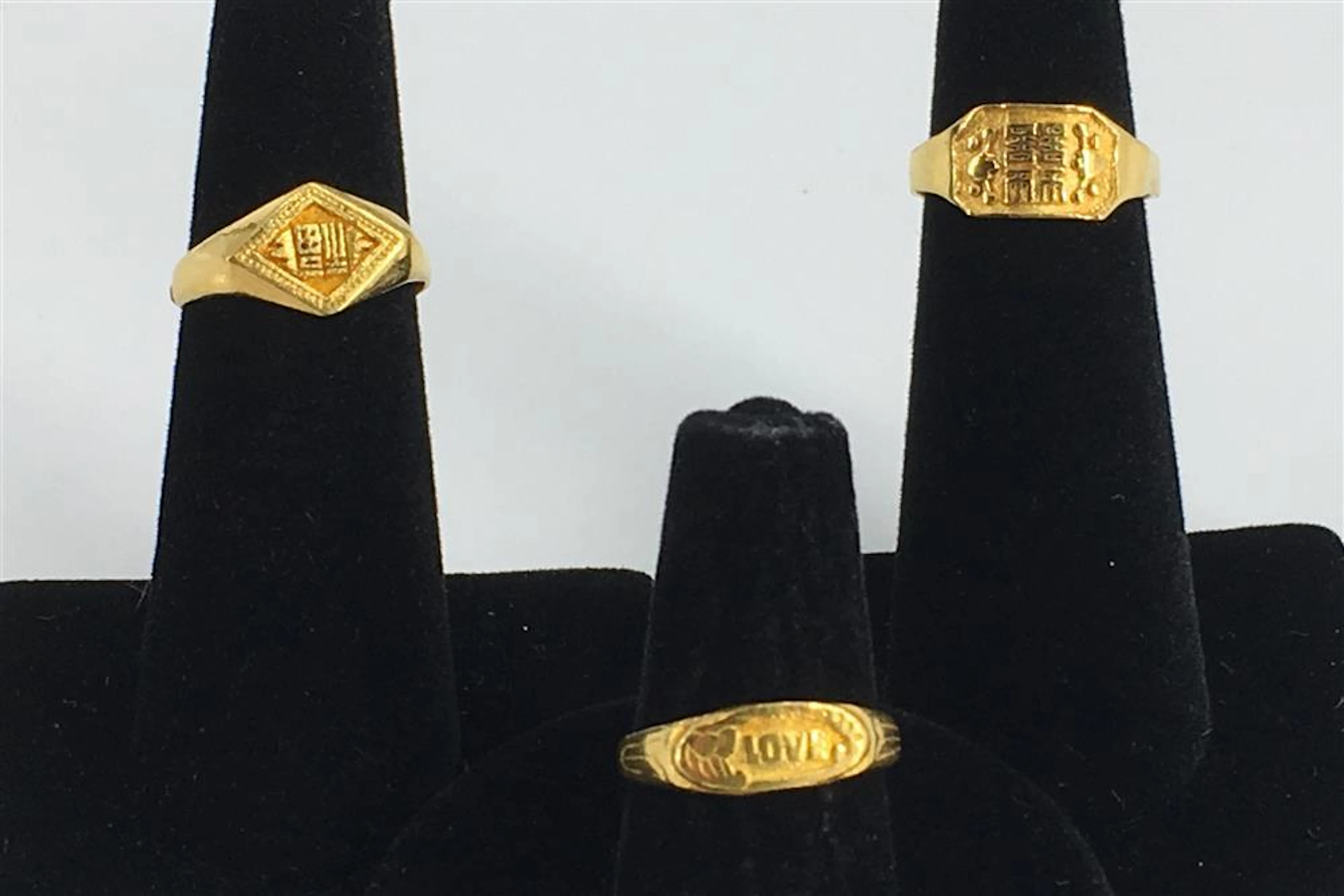 THREE 23KT+ YELLOW GOLD RINGS
