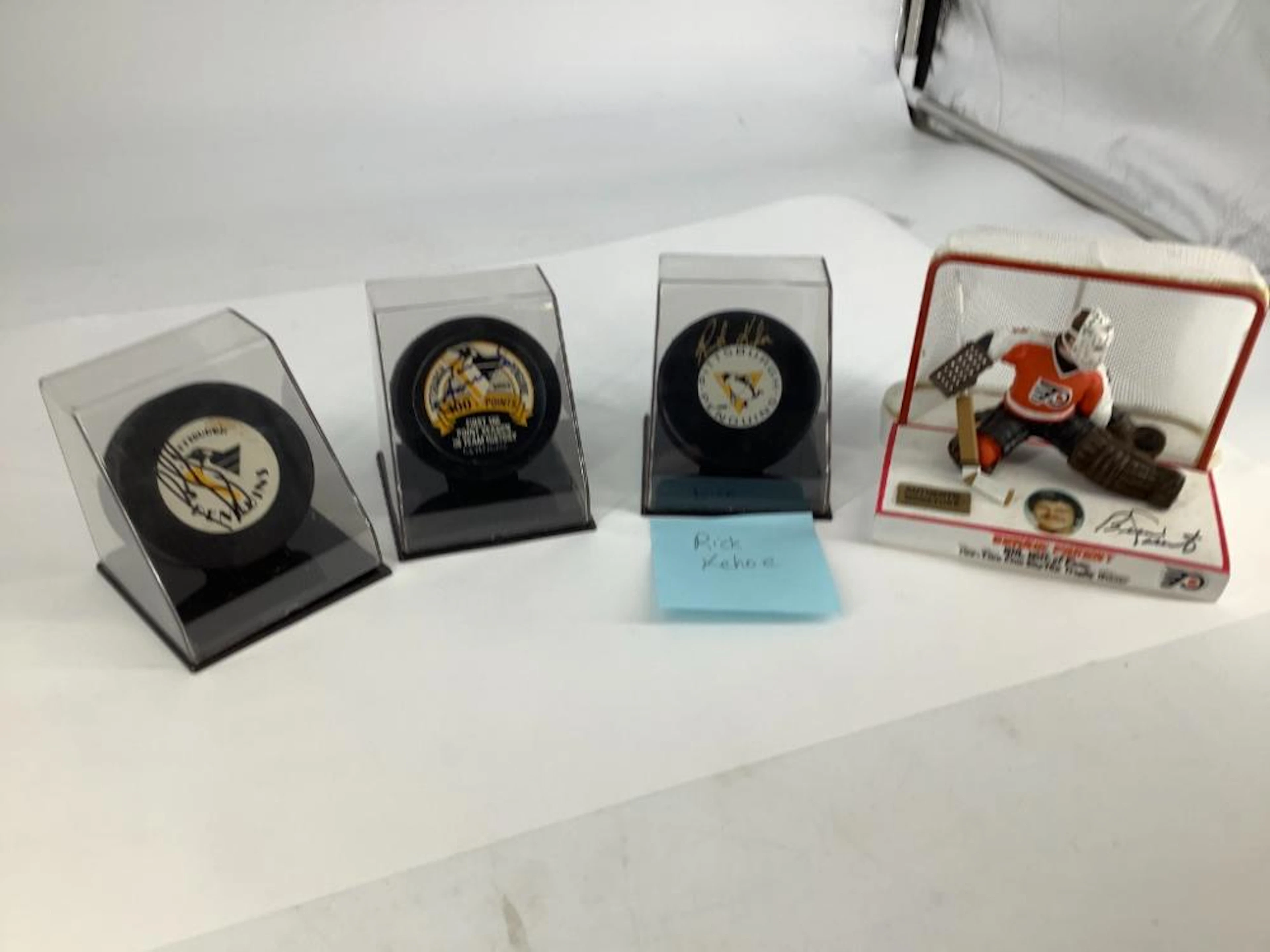 BOX LOT OF HOCKEY MEMORABILIA INCLUDING A SIGNED BERNIE...