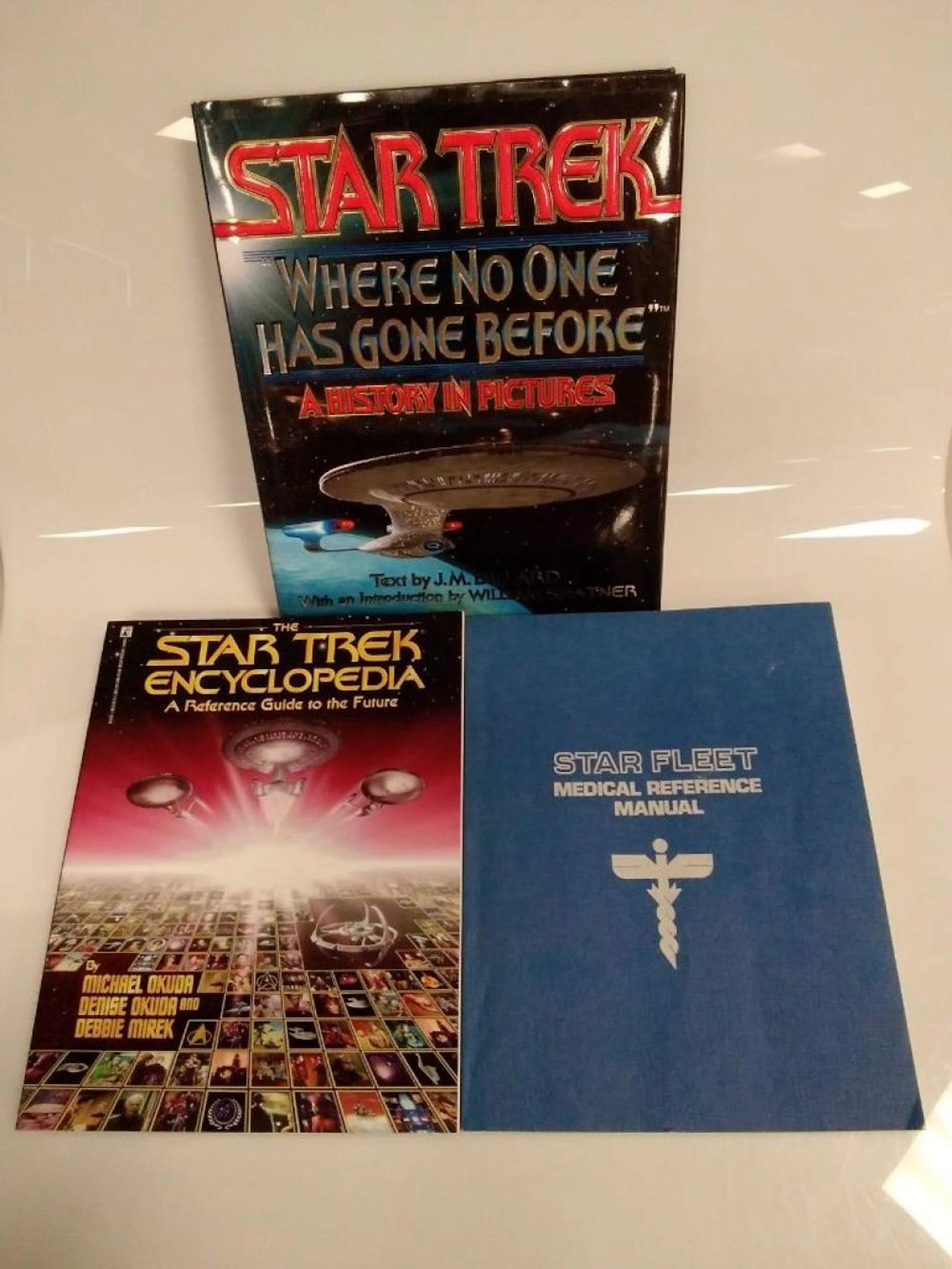 Box lot 3 Star Trek books including the "Starfleet Medical Reference Manual"