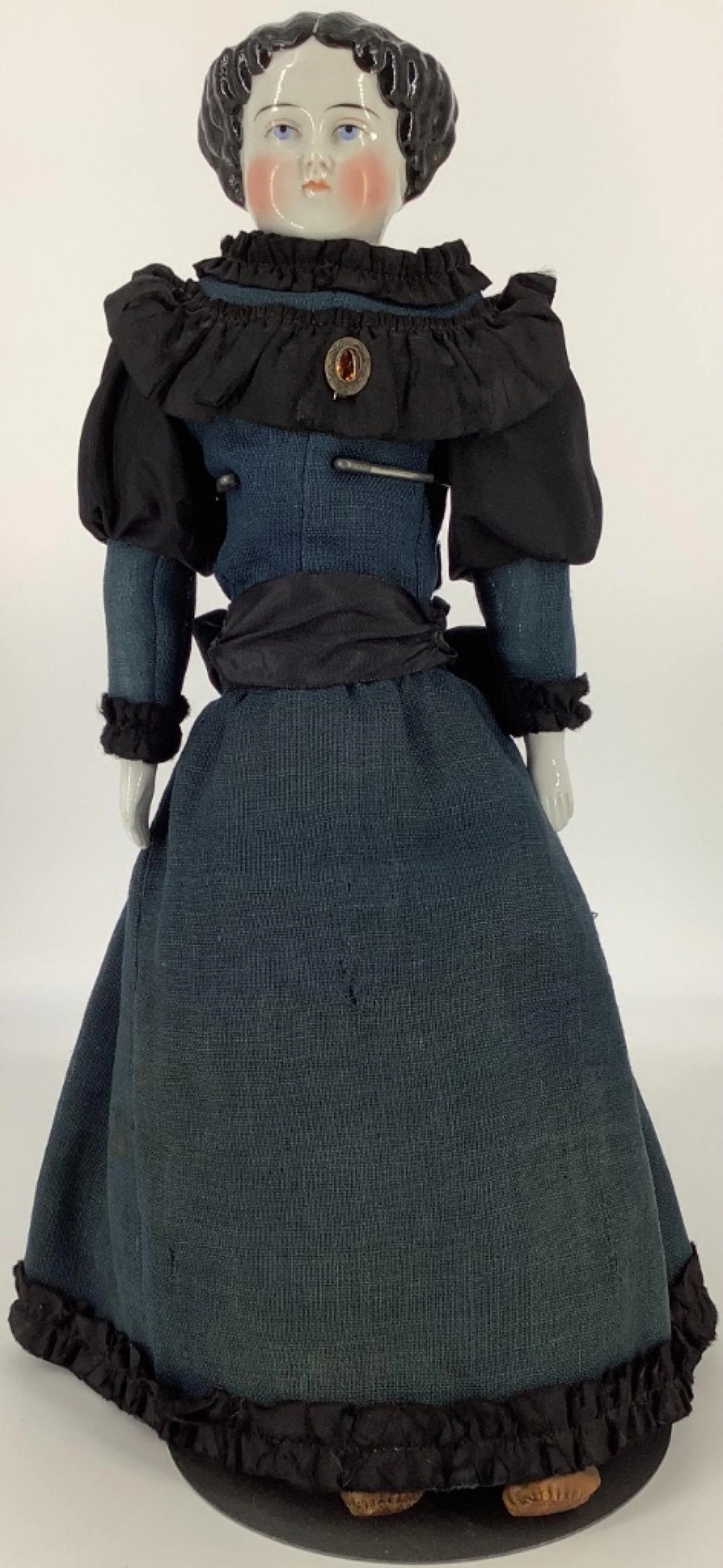 19" German flat top china head doll on cloth body with china lower arms