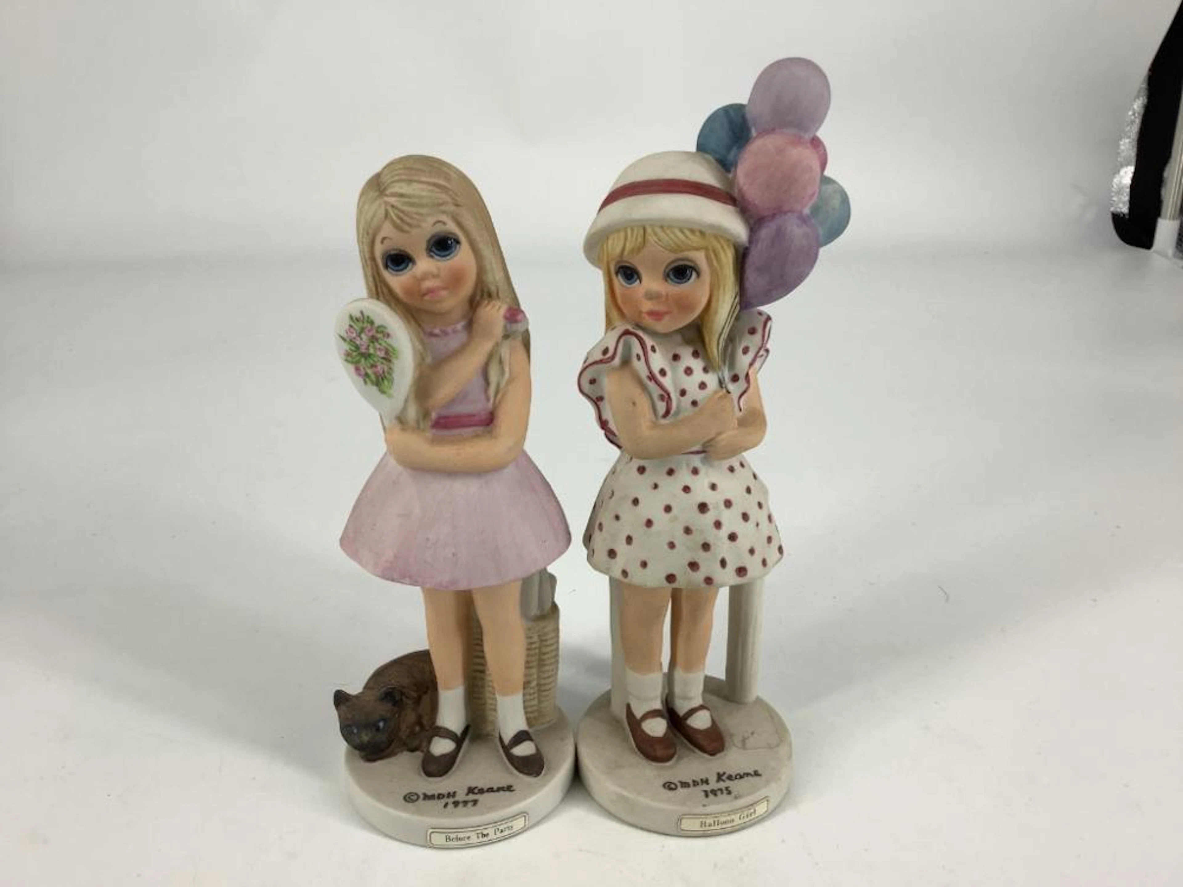 2 Margaret Keane figurines including balloon girl. Both 6.5?