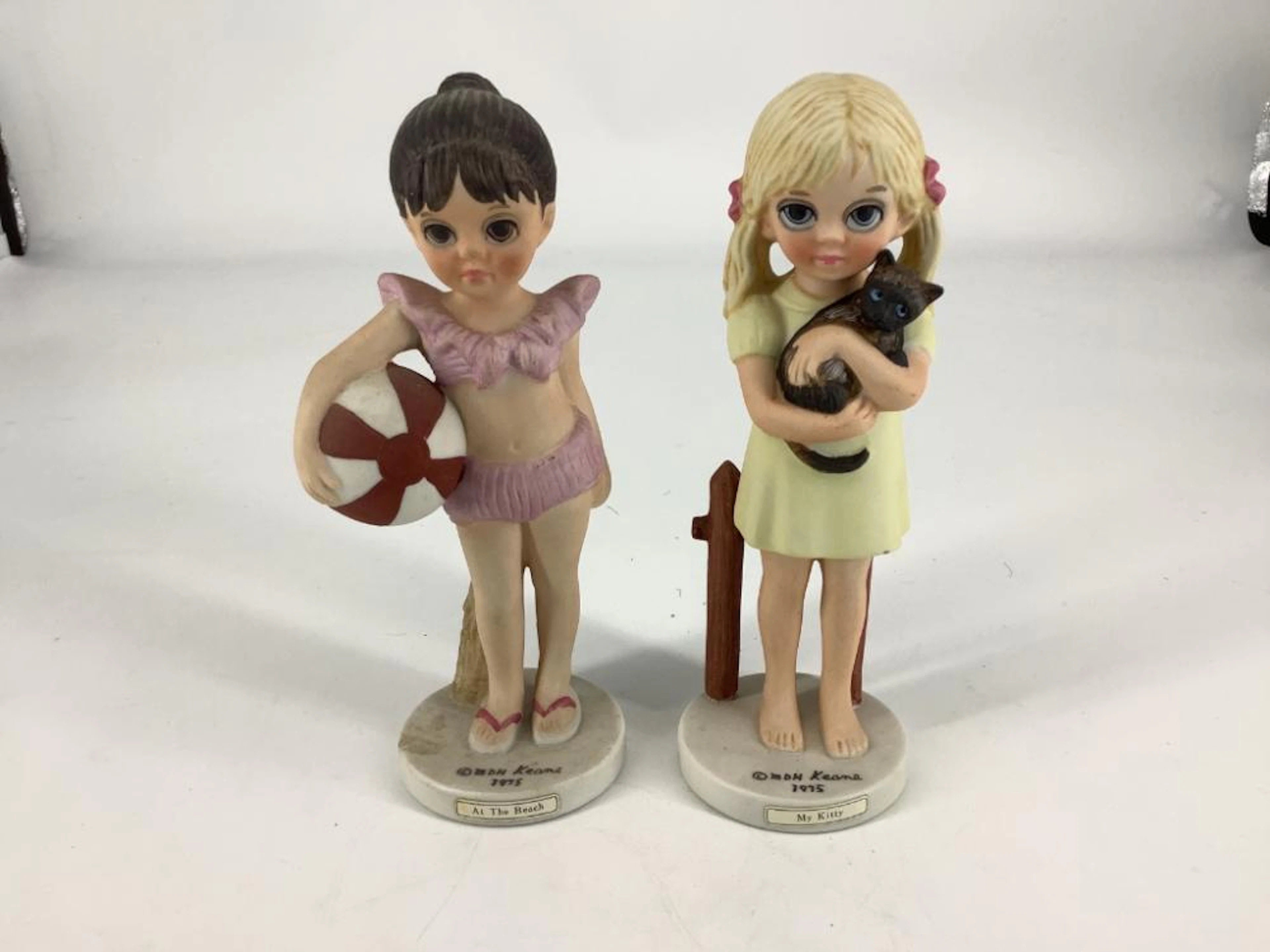 2 Margaret Keane figurines including my kitty. Both 6.5?