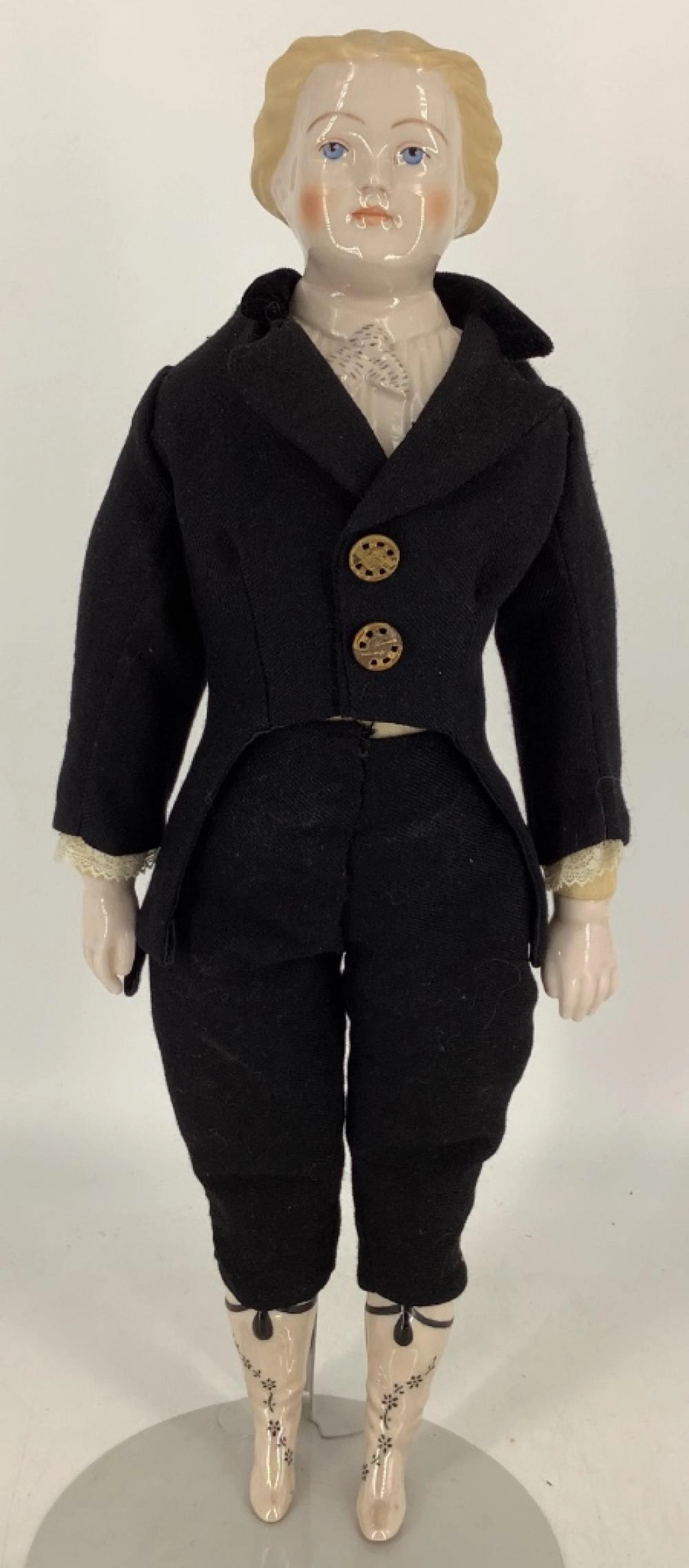 Reproduction china shoulder head doll dressed as a man