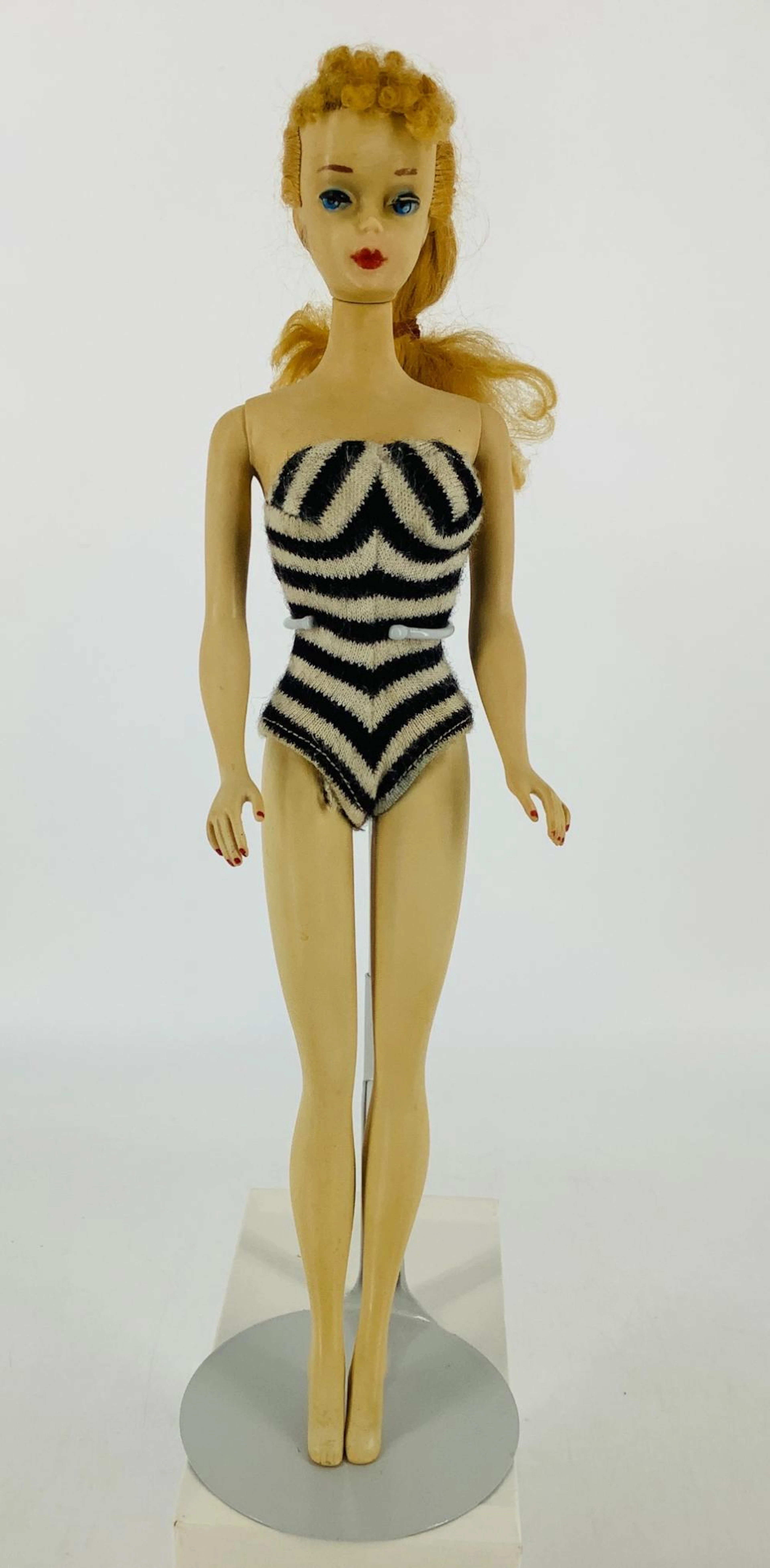 # 3 Blond Ponytail wearing original bathing suit