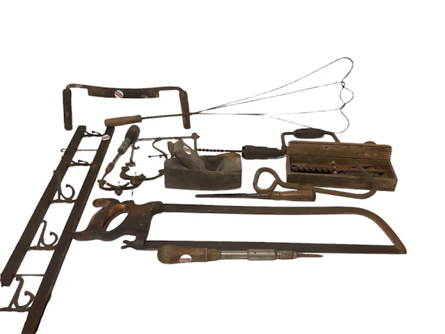 Lot of vintage wood and metal hand tools including saws