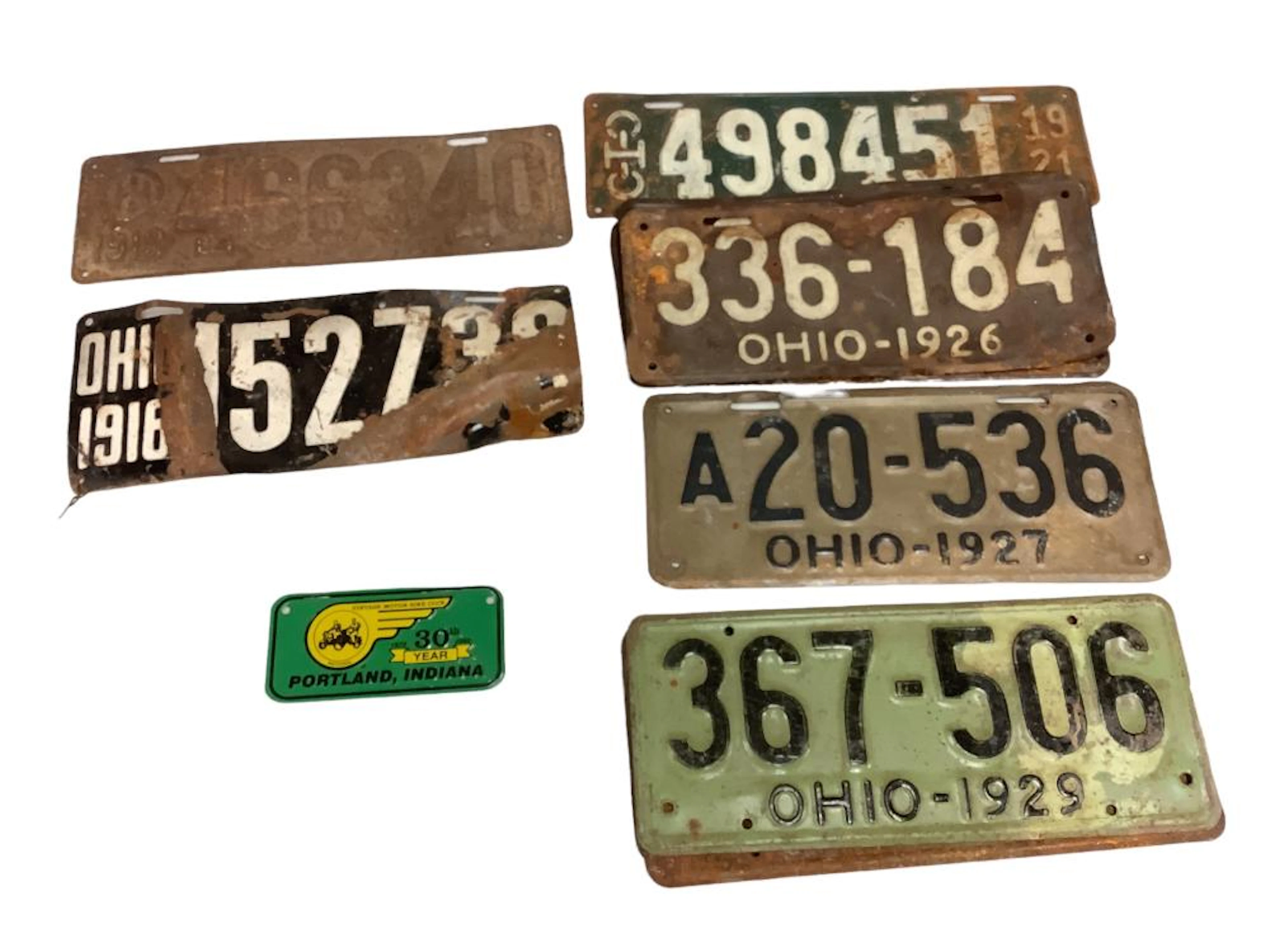 Vintage license plates one from 1919 and count of 11 dated 1921 - 1929.