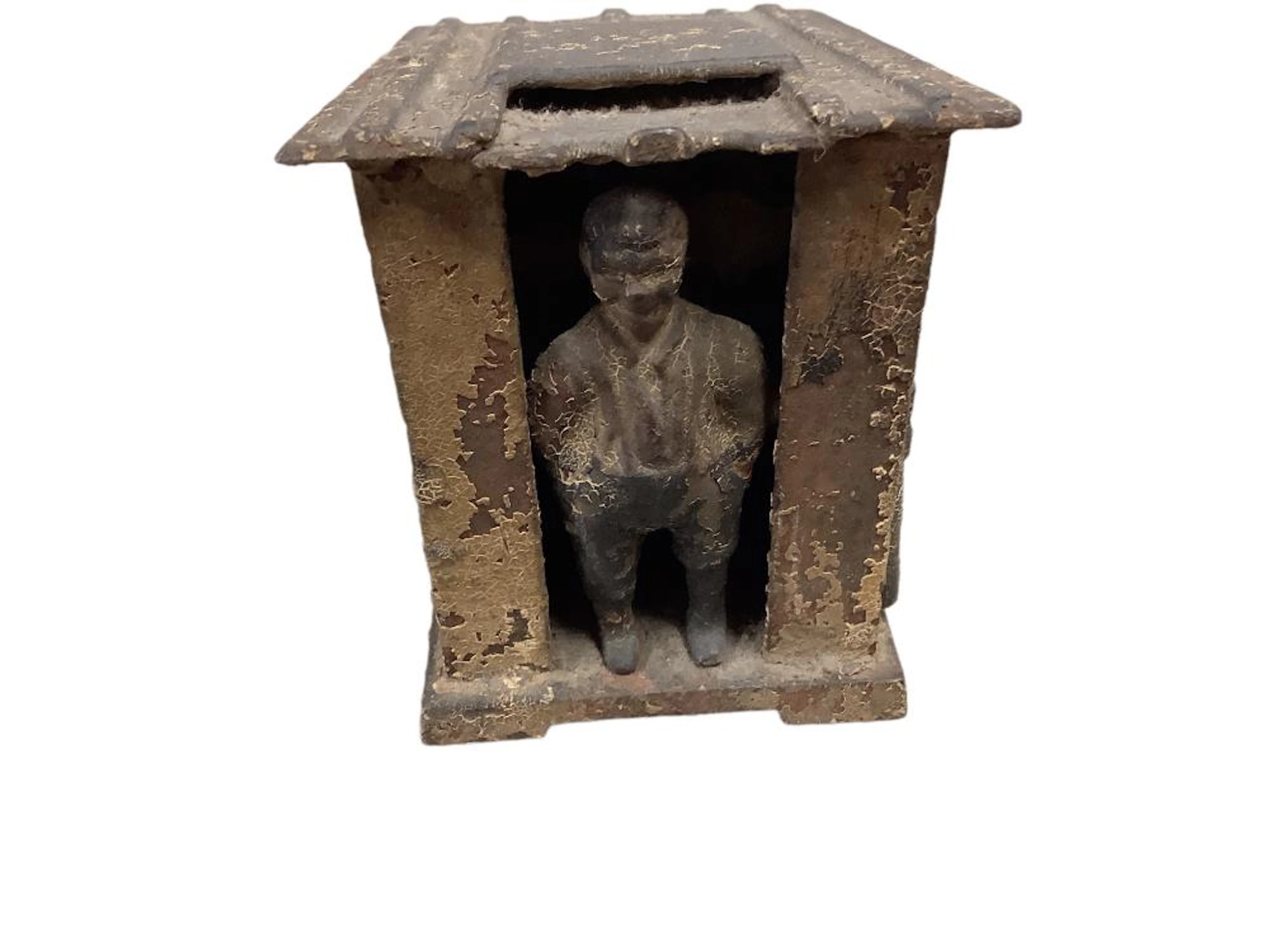 Vintage American a cast iron Uncle Tom?s cab in bank