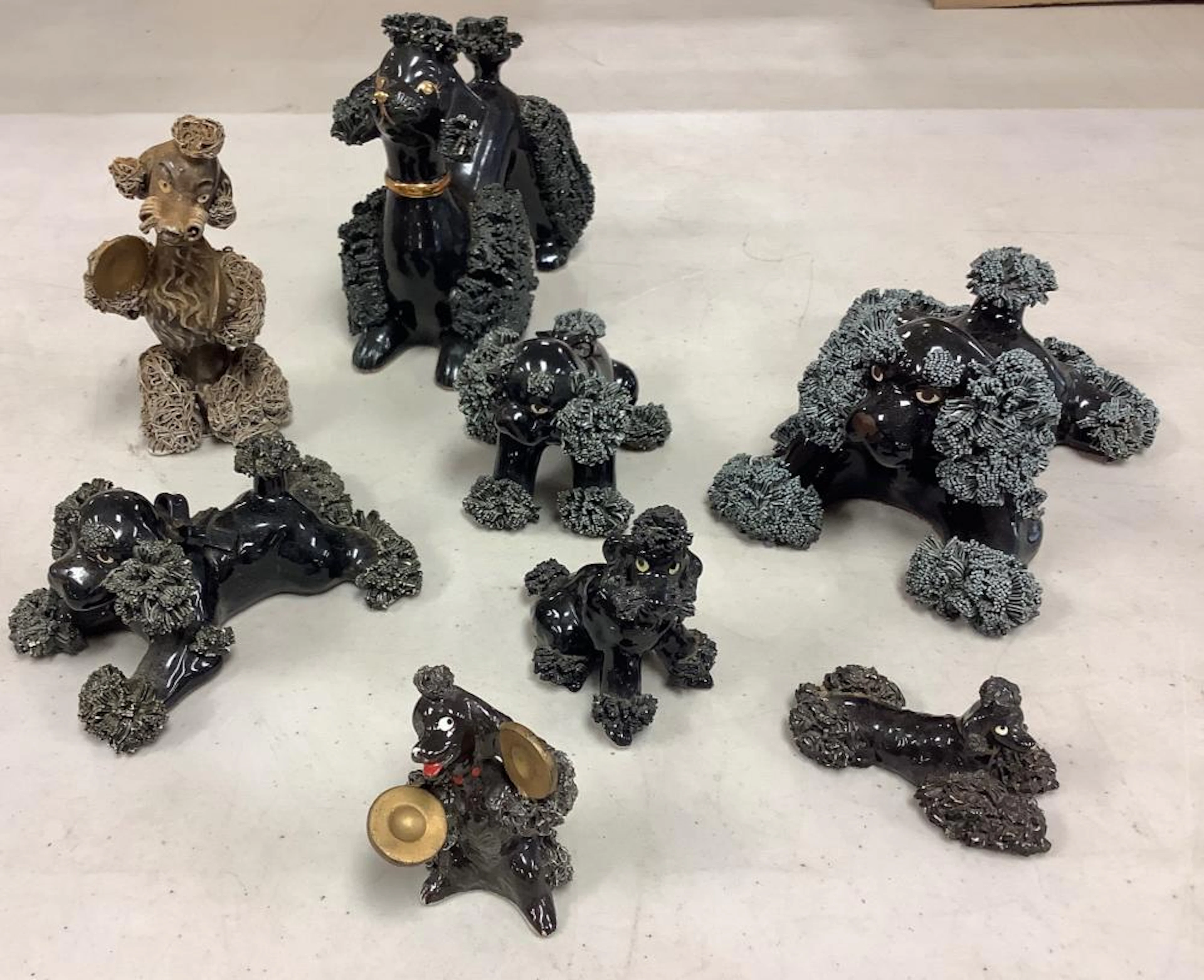 Vintage Spaghetti black Poodle figurines and one brown...