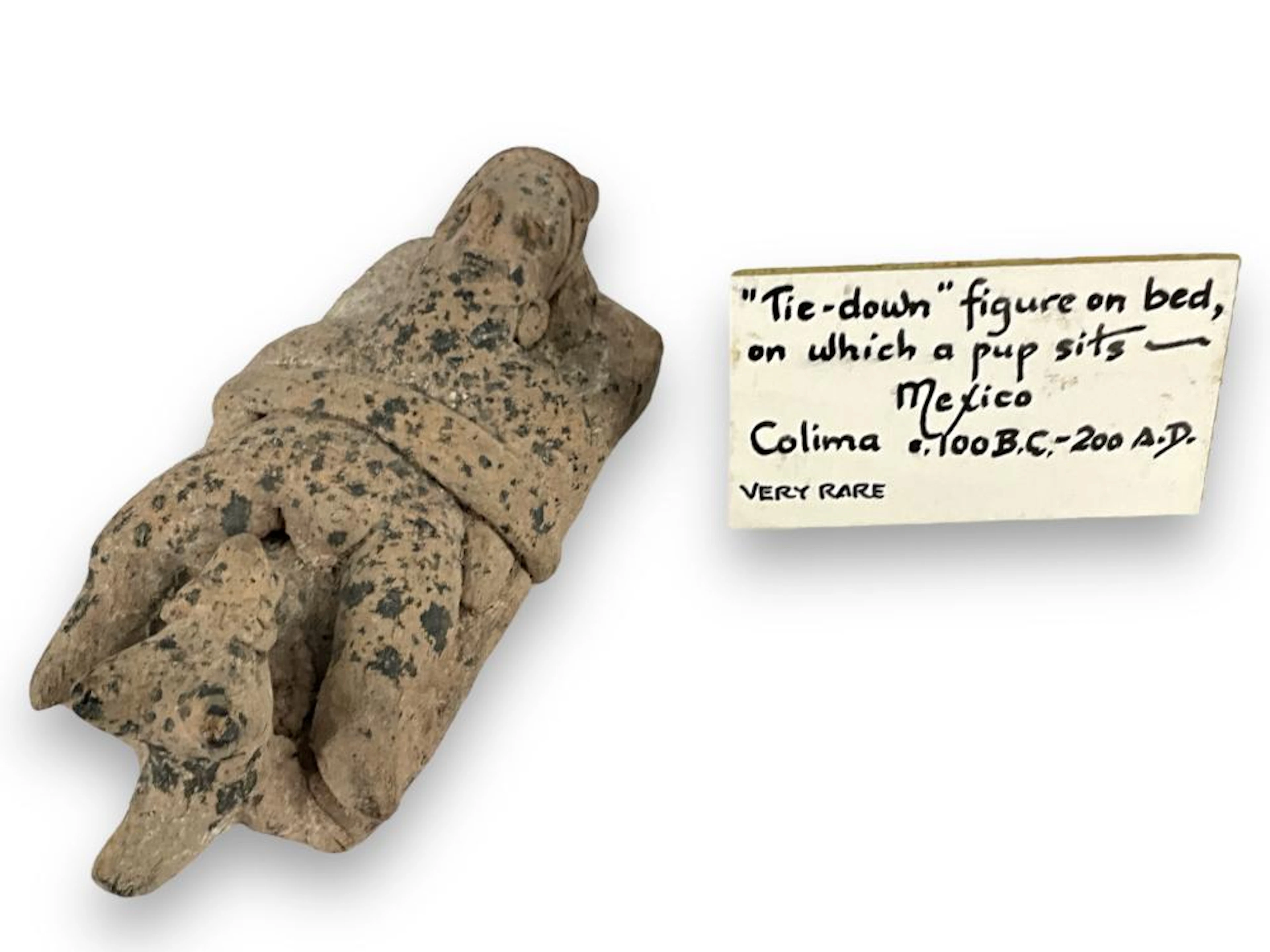 Stone Figurine on Bed