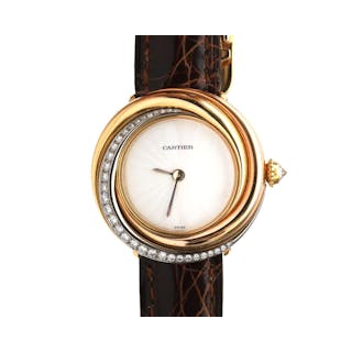An 18 karat gold Cartier Trinity ladies wristwatch with diamonds