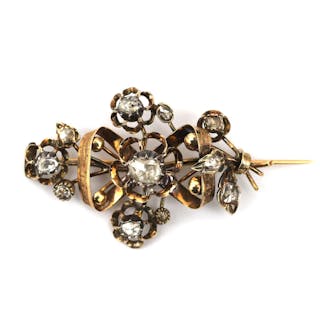 An antique 14 karat gold rose cut diamond flower brooch